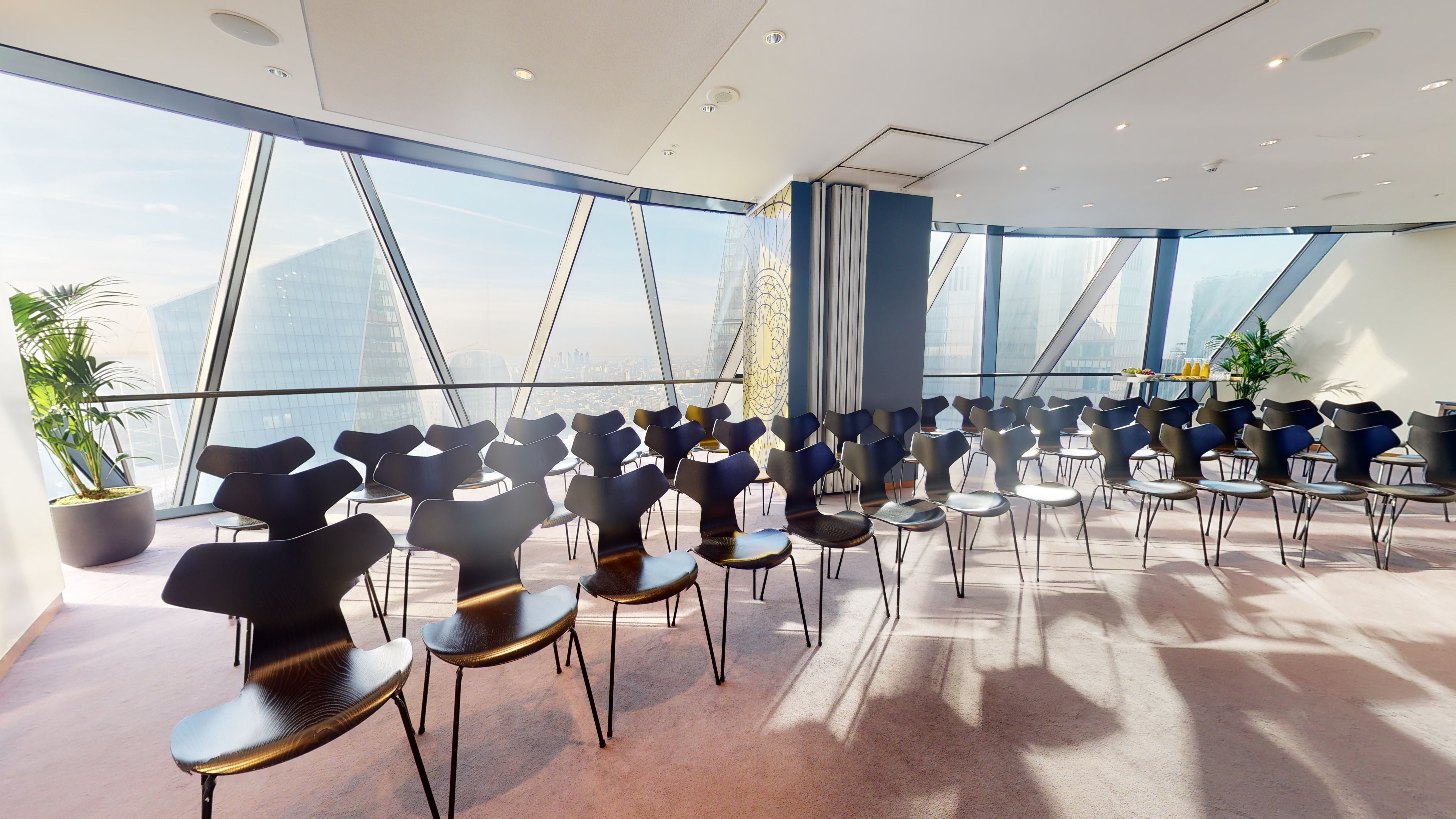 Double private dining rooms at Searcys, modern space with floor-to-ceiling windows for events.