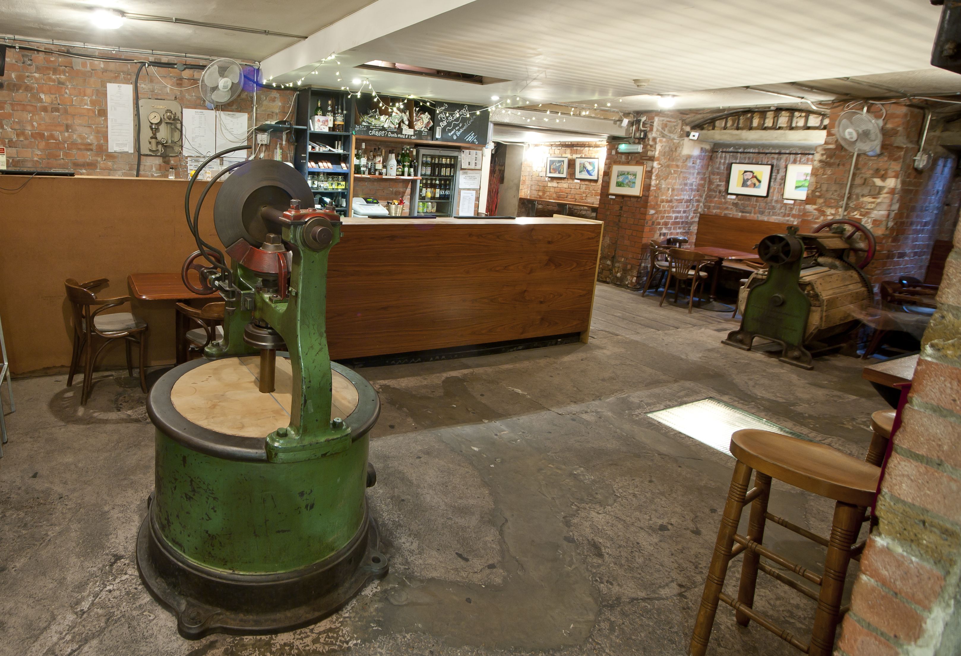 Theatre Bar at St Bride Foundation: rustic venue with exposed brick for events and gatherings.