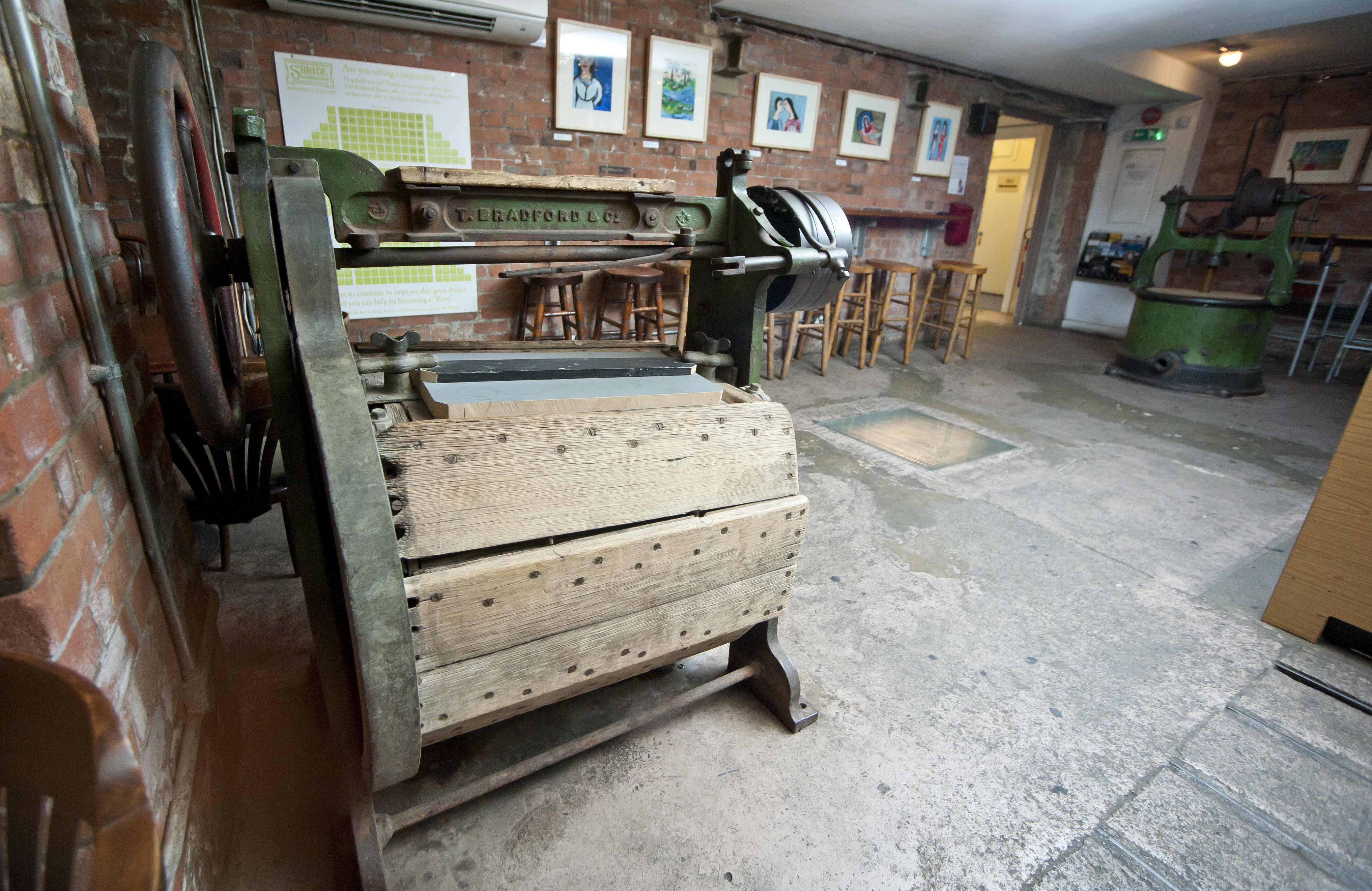 Theatre Bar at St Bride Foundation: rustic venue with vintage machinery for creative events.