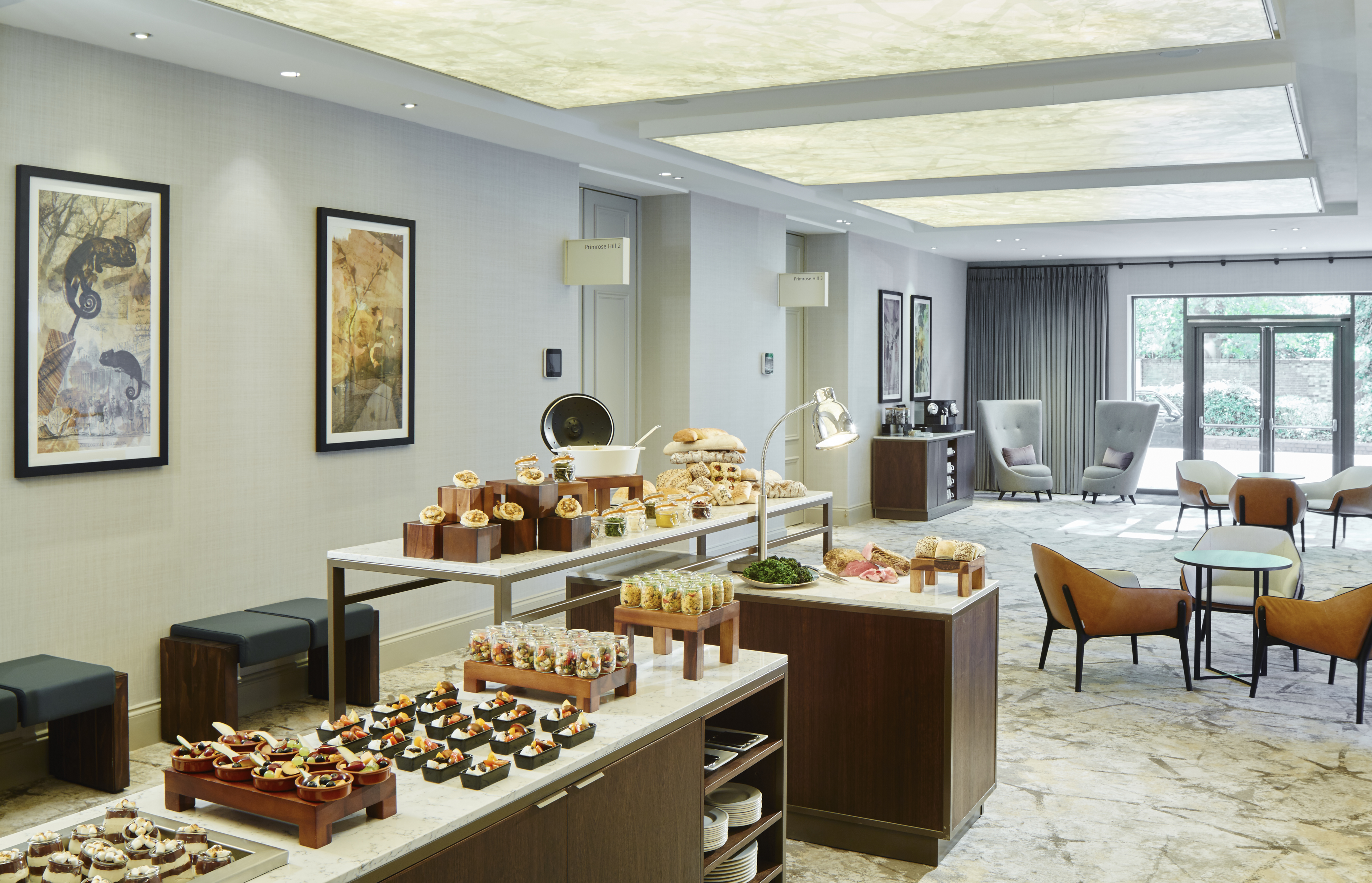 Elegant meeting space at London Marriott Regents Park with gourmet buffet setup.