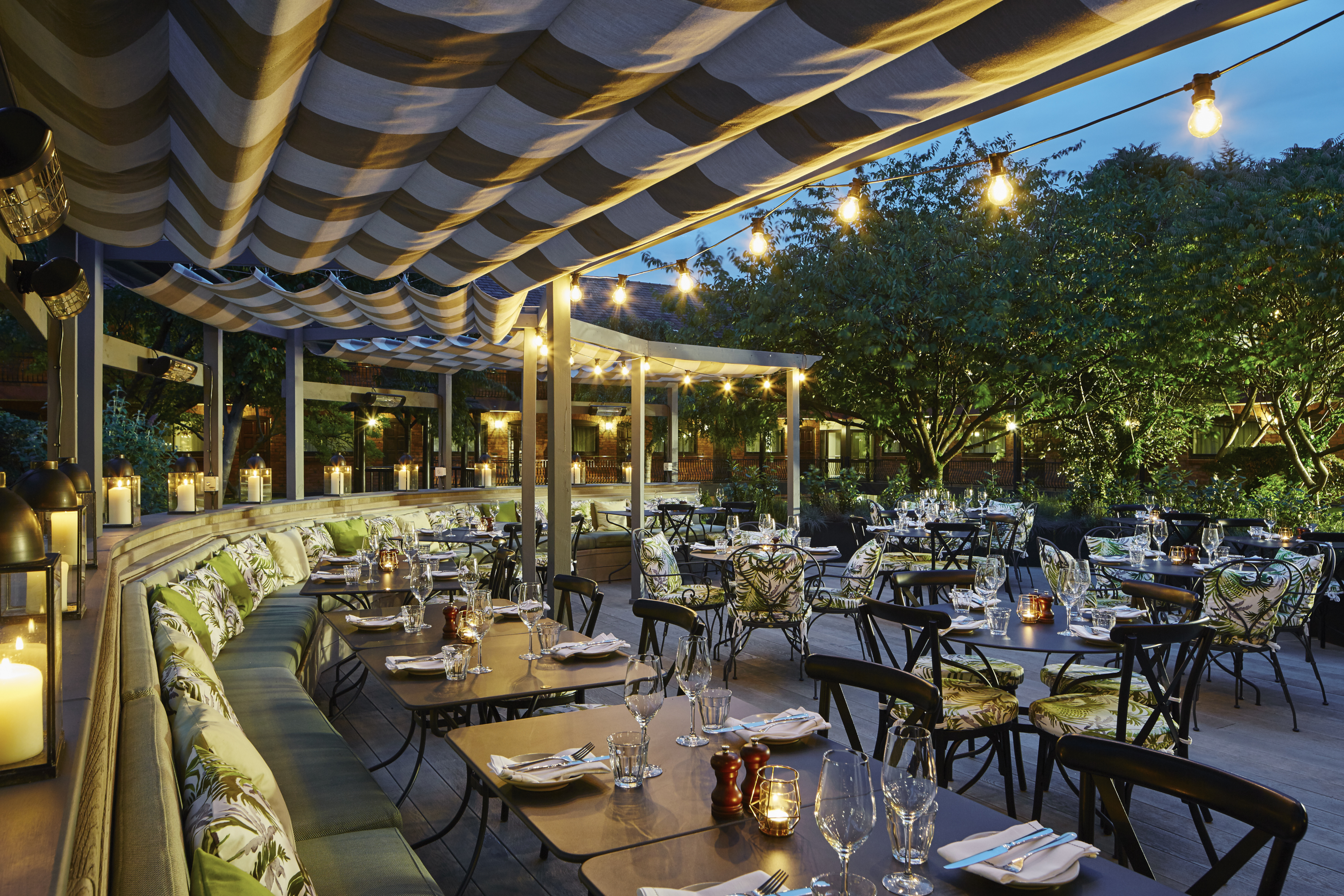 Cheshire Suite outdoor dining at Delta Hotels, ideal for events with cozy seating and greenery.