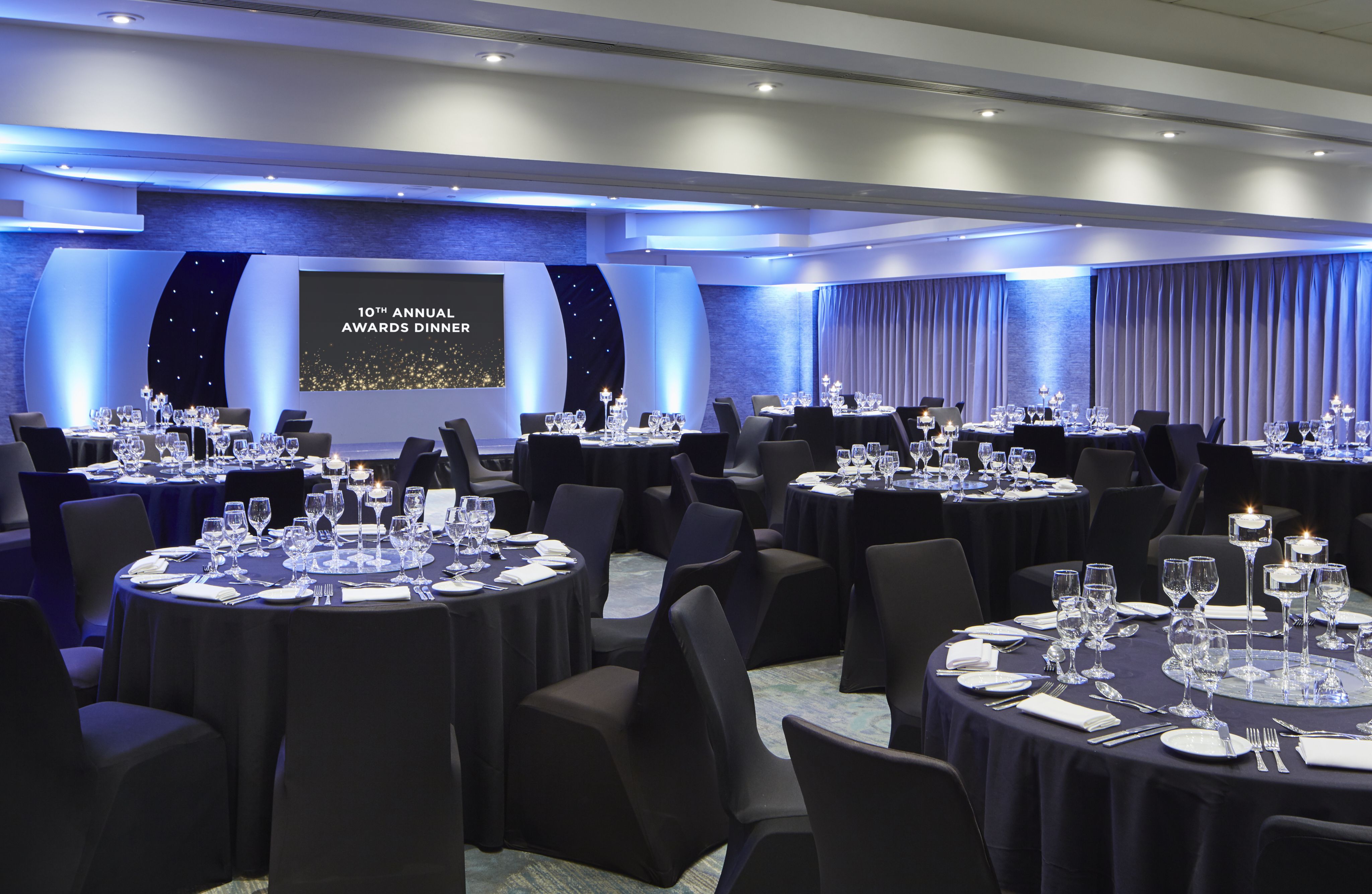 Cheshire Suite at Delta Hotels: elegant awards dinner setup with black linens and warm lighting.