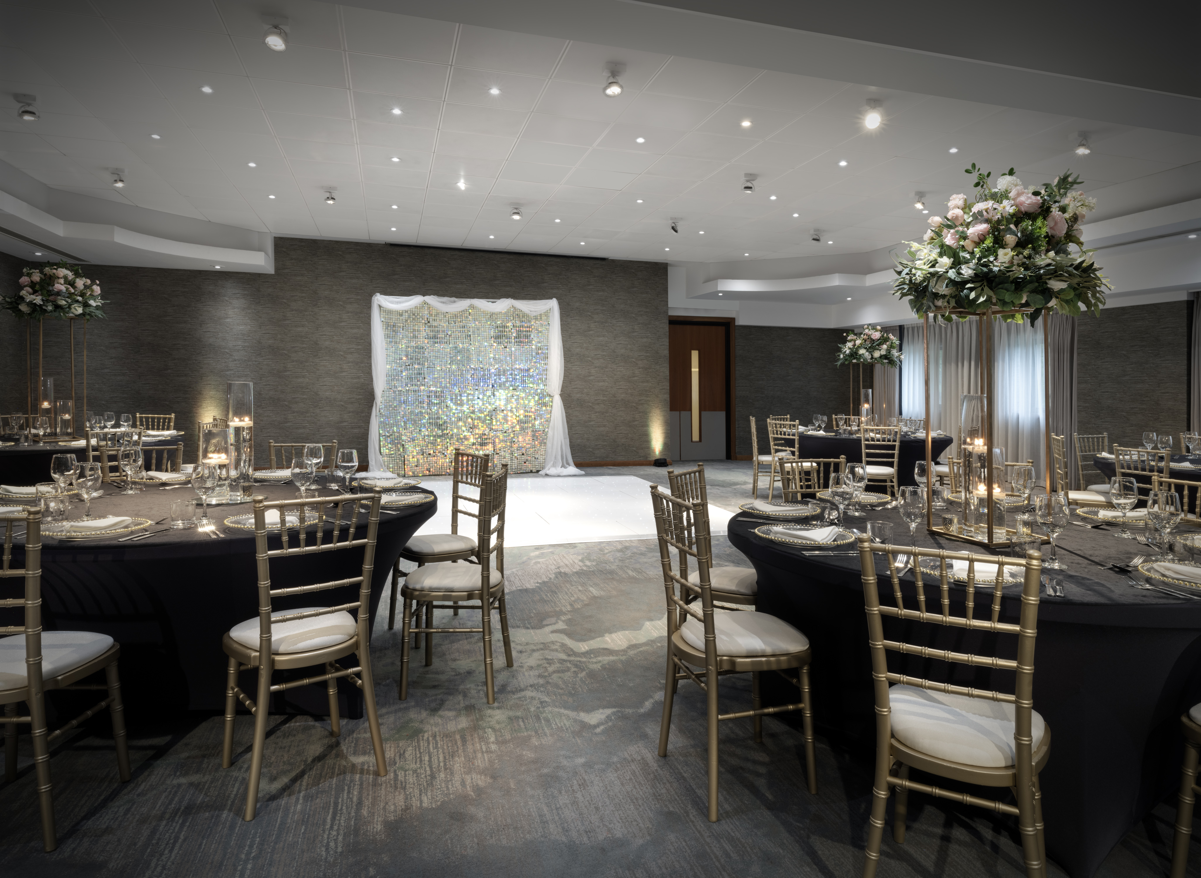 Cheshire Suite at Delta Hotels: elegant event space with floral centerpieces for weddings, corporate events.
