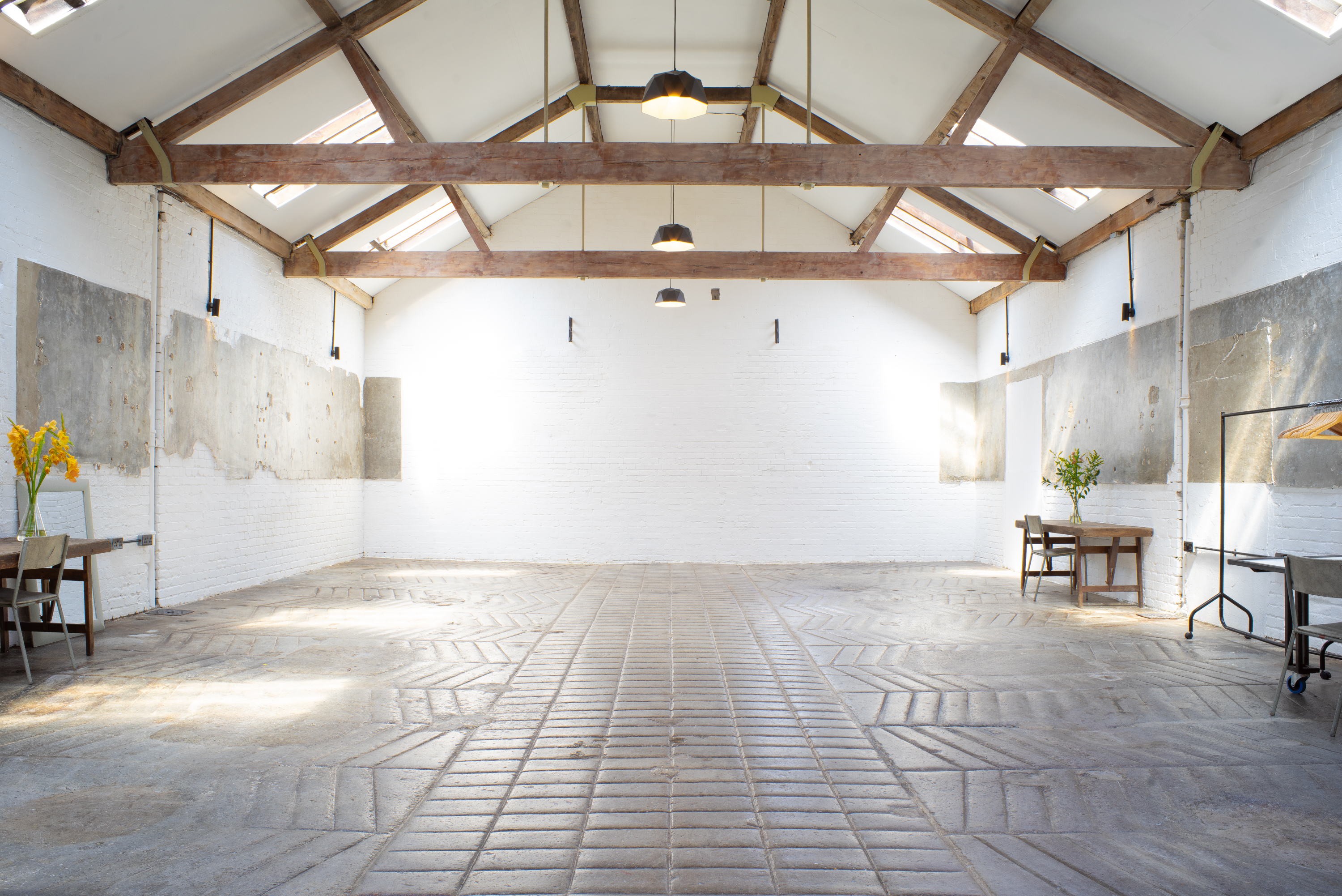 Spacious event venue with high ceilings, ideal for corporate meetings and workshops.