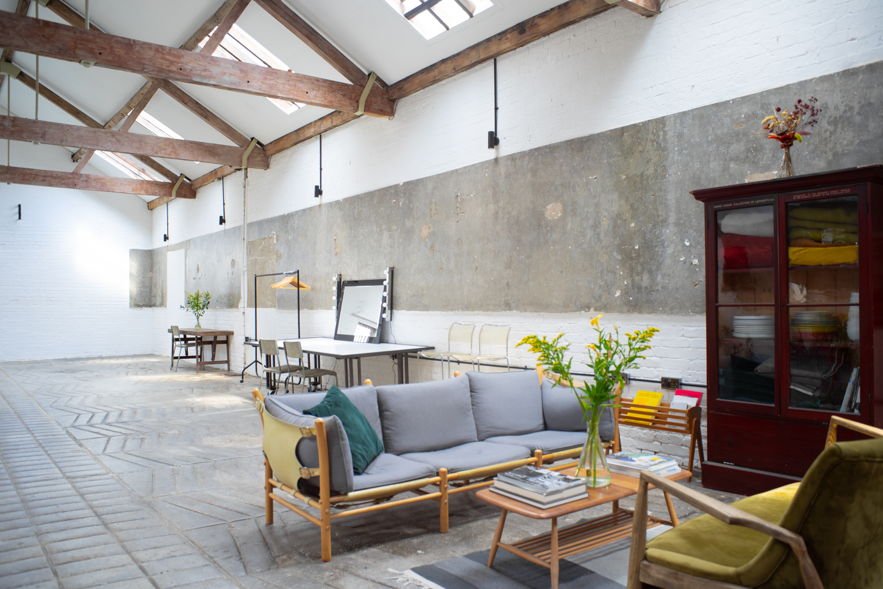 Versatile event space with high ceilings, ideal for meetings and workshops.