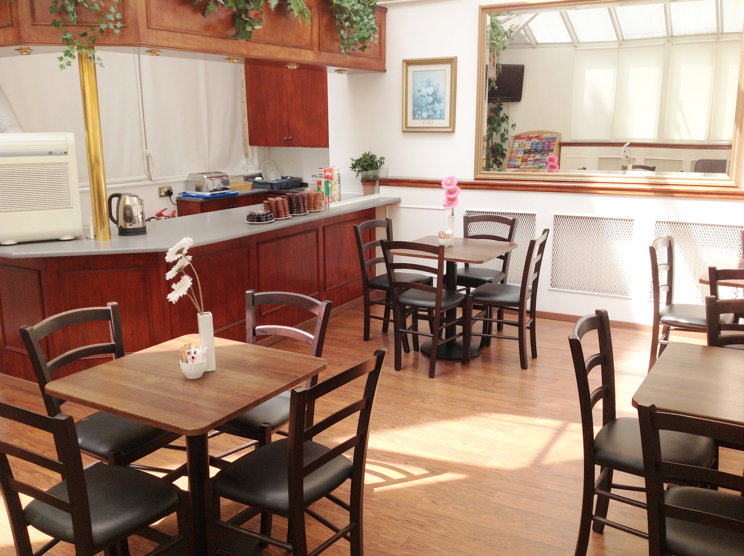 Meeting Room in Space 88 with wooden tables, ideal for casual meetings and networking events.