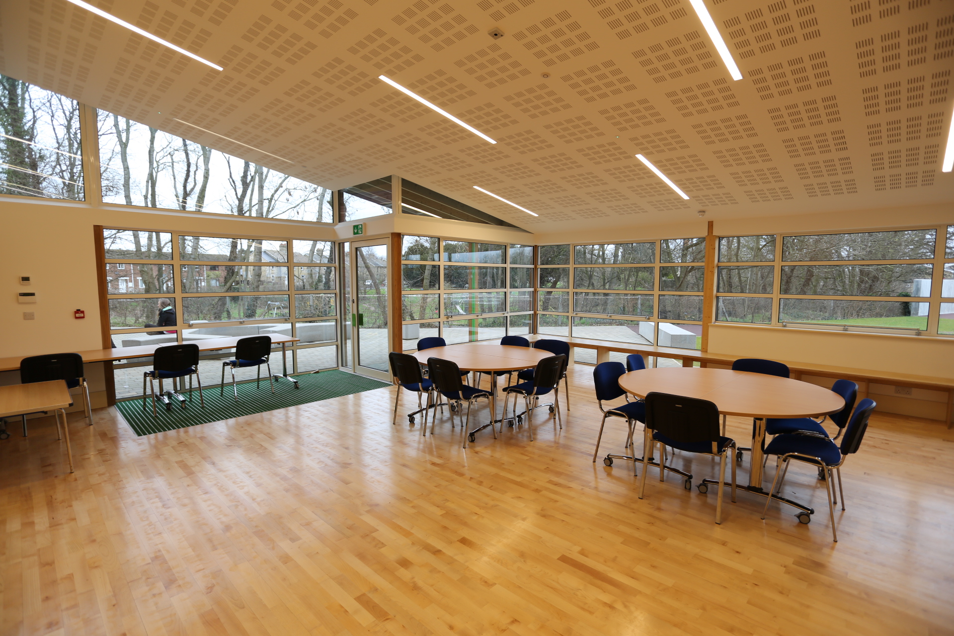 Versatile meeting space with natural light at Gamlingay Eco Hub for workshops and gatherings.