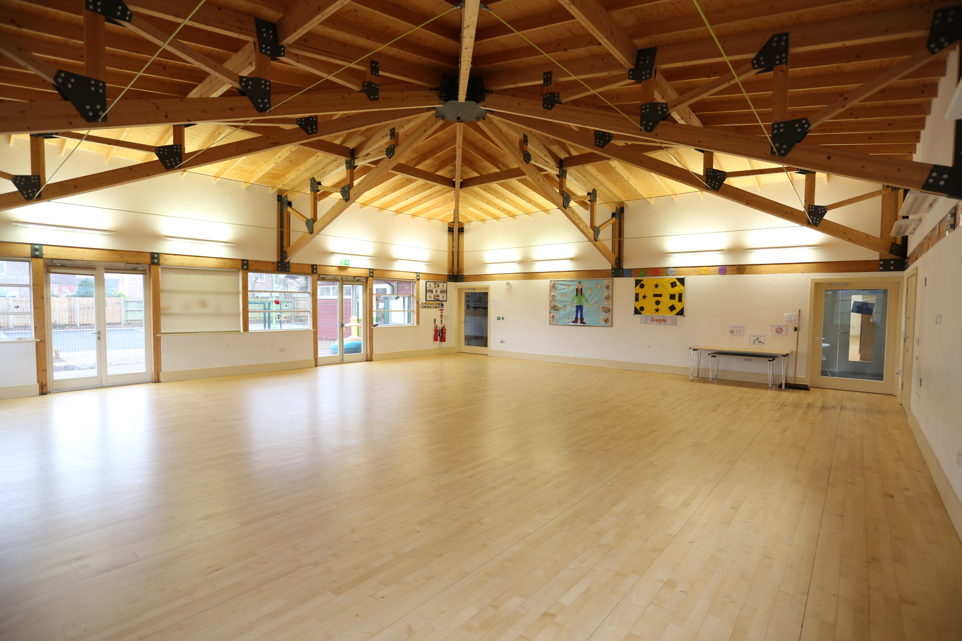 Spacious Gamlingay Eco Hub venue with high wooden ceiling for workshops and events.