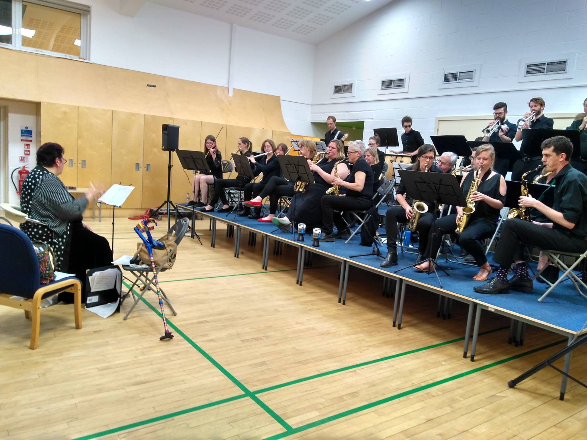 Rehearsal space at Gamlingay Eco Hub with conductor and musicians for live music events.