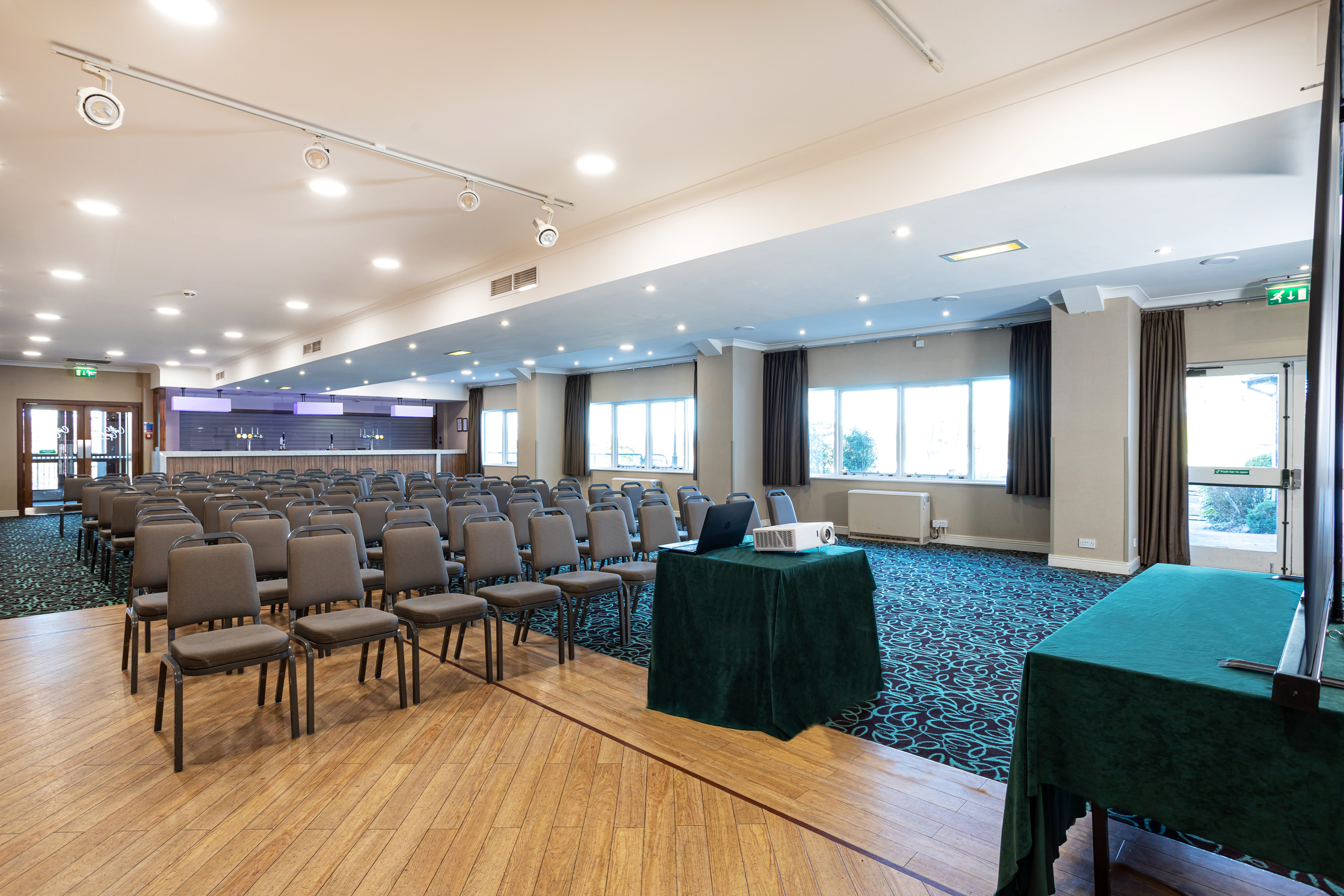 Function Suite at Castle Green Hotel, ideal for conferences with natural light and seating.