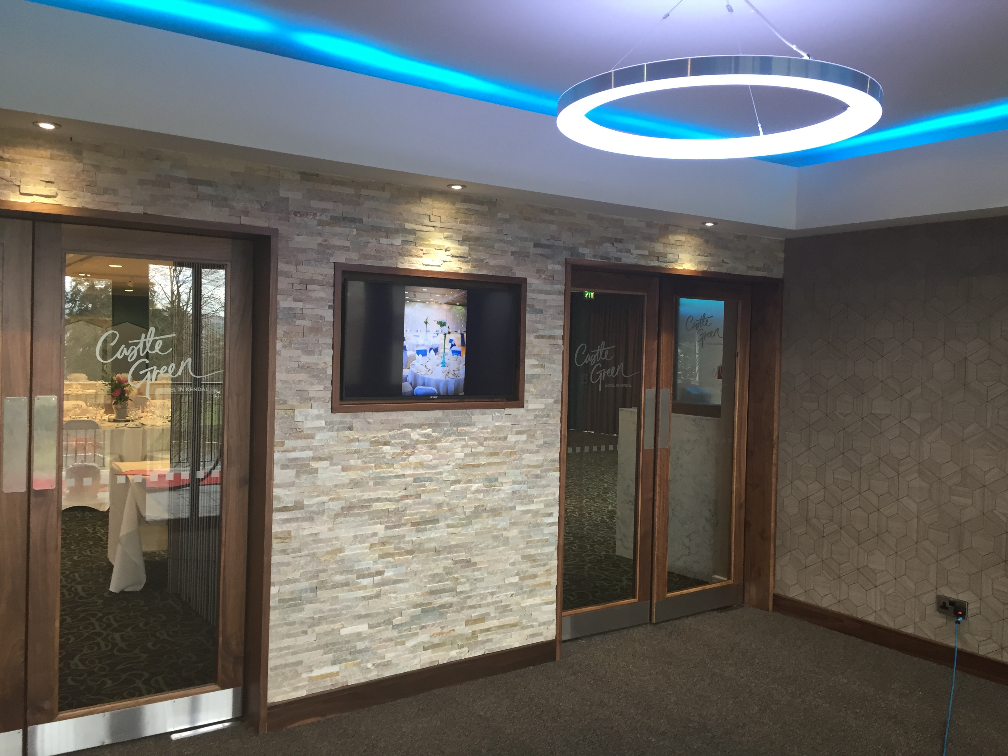 Function Suite entrance at Castle Green Hotel with modern decor, ideal for meetings and events.