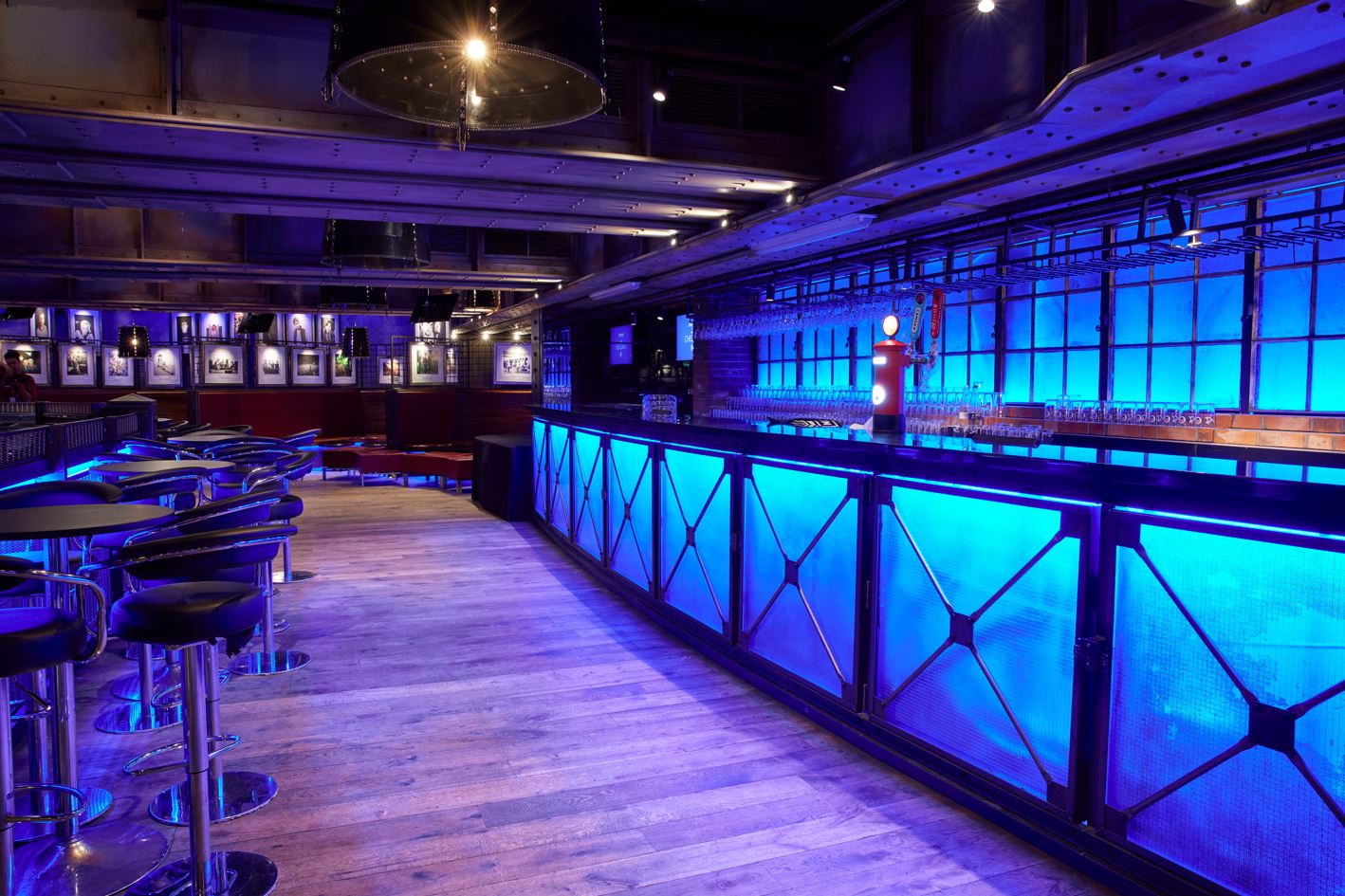 Modern event space at Chelsea FC with vibrant blue lighting, perfect for networking events.
