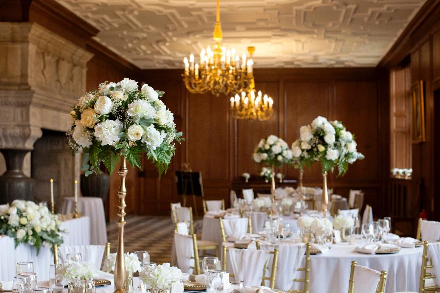 Elegant Mansion House event space with floral centerpieces for weddings and galas.