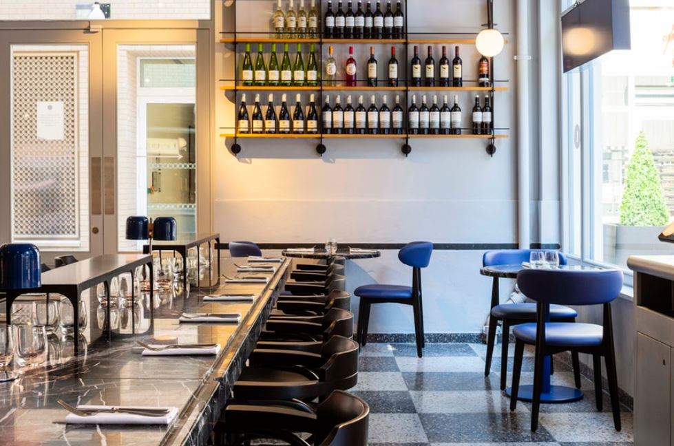 Modern dining space at The Den, Covent Garden, ideal for intimate events and networking.