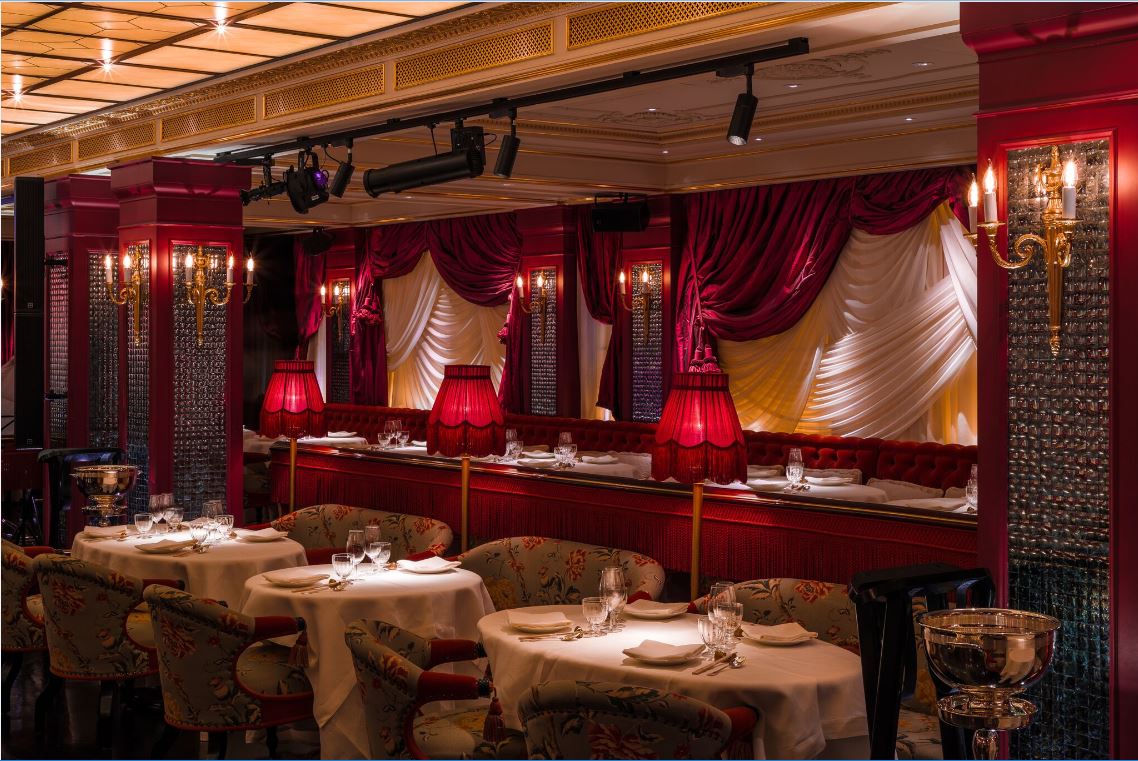 Elegant dining space at Salon De Chine, featuring rich red decor for upscale events.