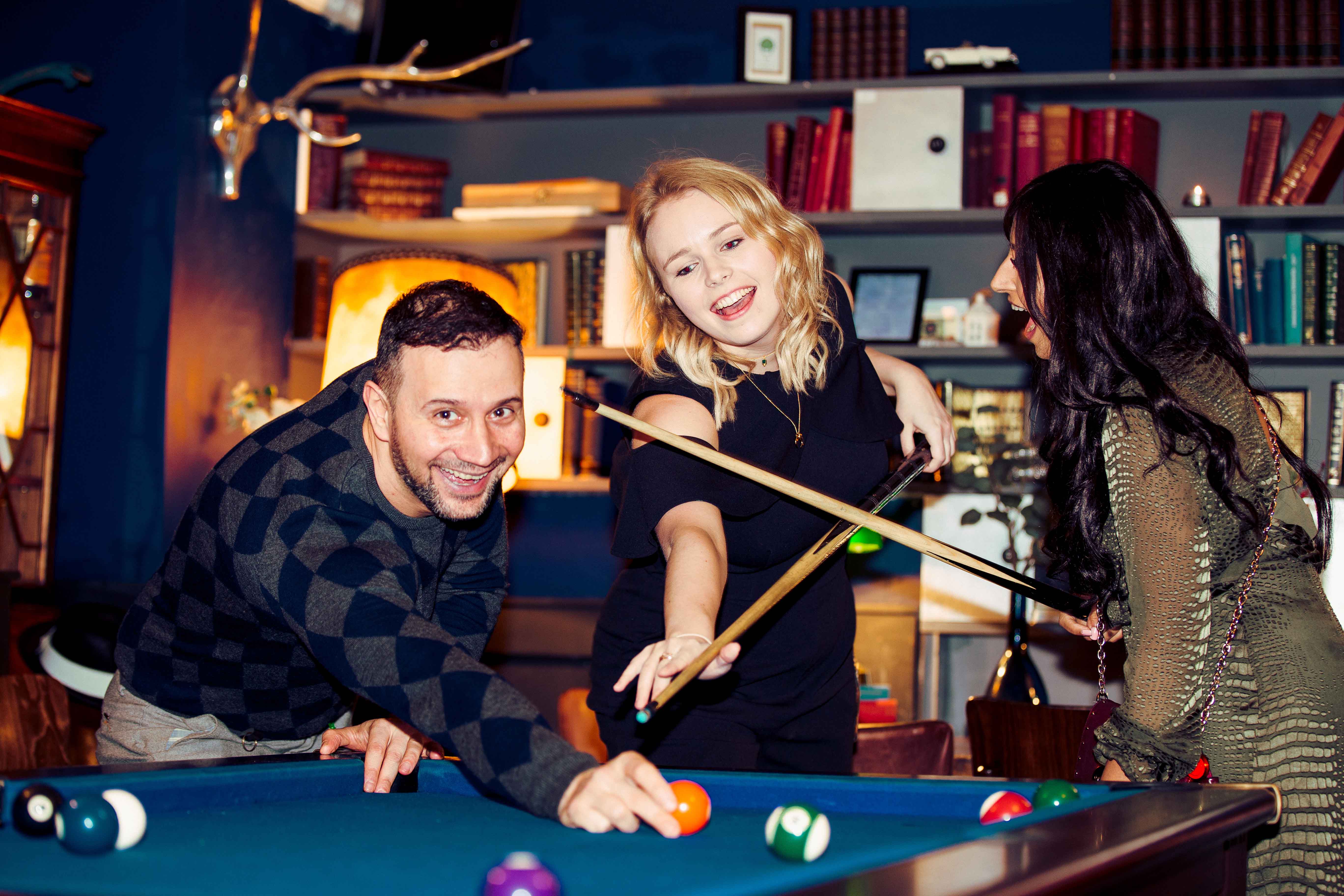 Vibrant social gathering at The Study, featuring a pool table for networking events.
