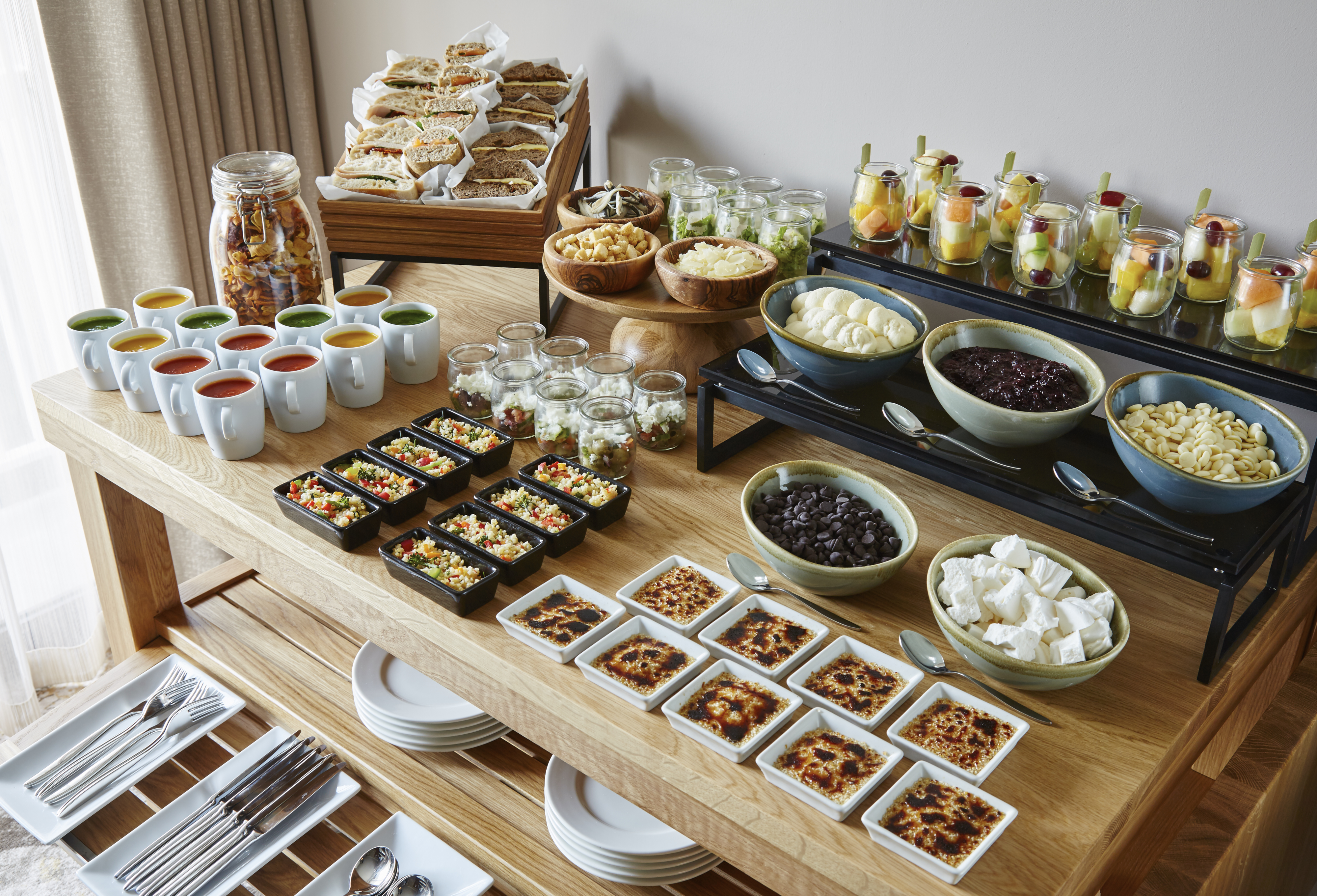 Buffet setup at Hampstead Marriott for events, featuring colorful salads and desserts.