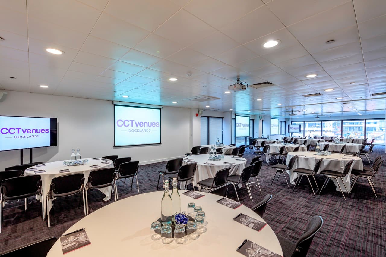 Conference room at Sugar Suite Docklands with cabaret tables for workshops and training events.