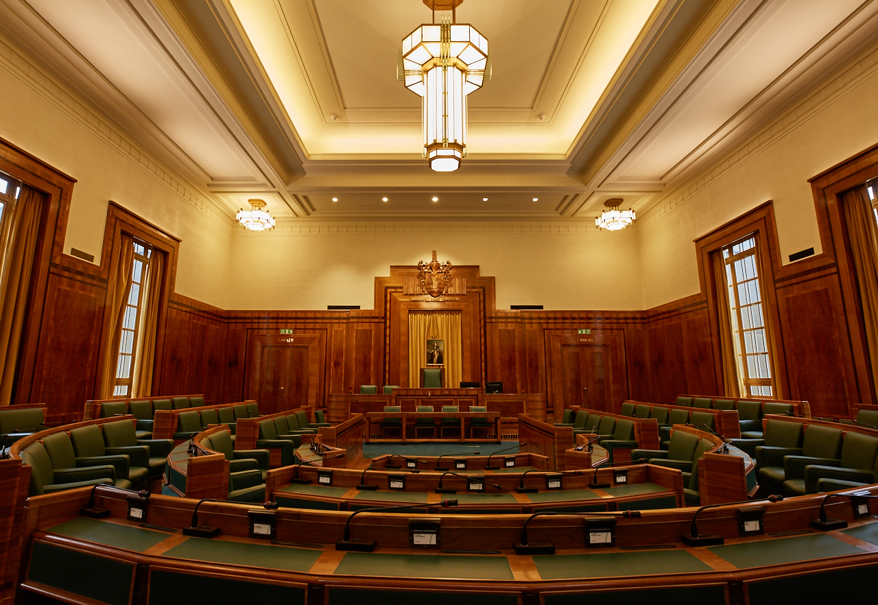 Council Chamber at Hackney Town Hall with elegant wood paneling, ideal for conferences.