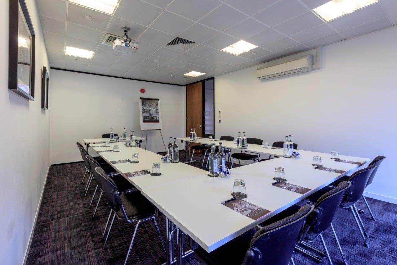 U-shaped Earl Grey meeting room for workshops or corporate board meetings in Docklands.