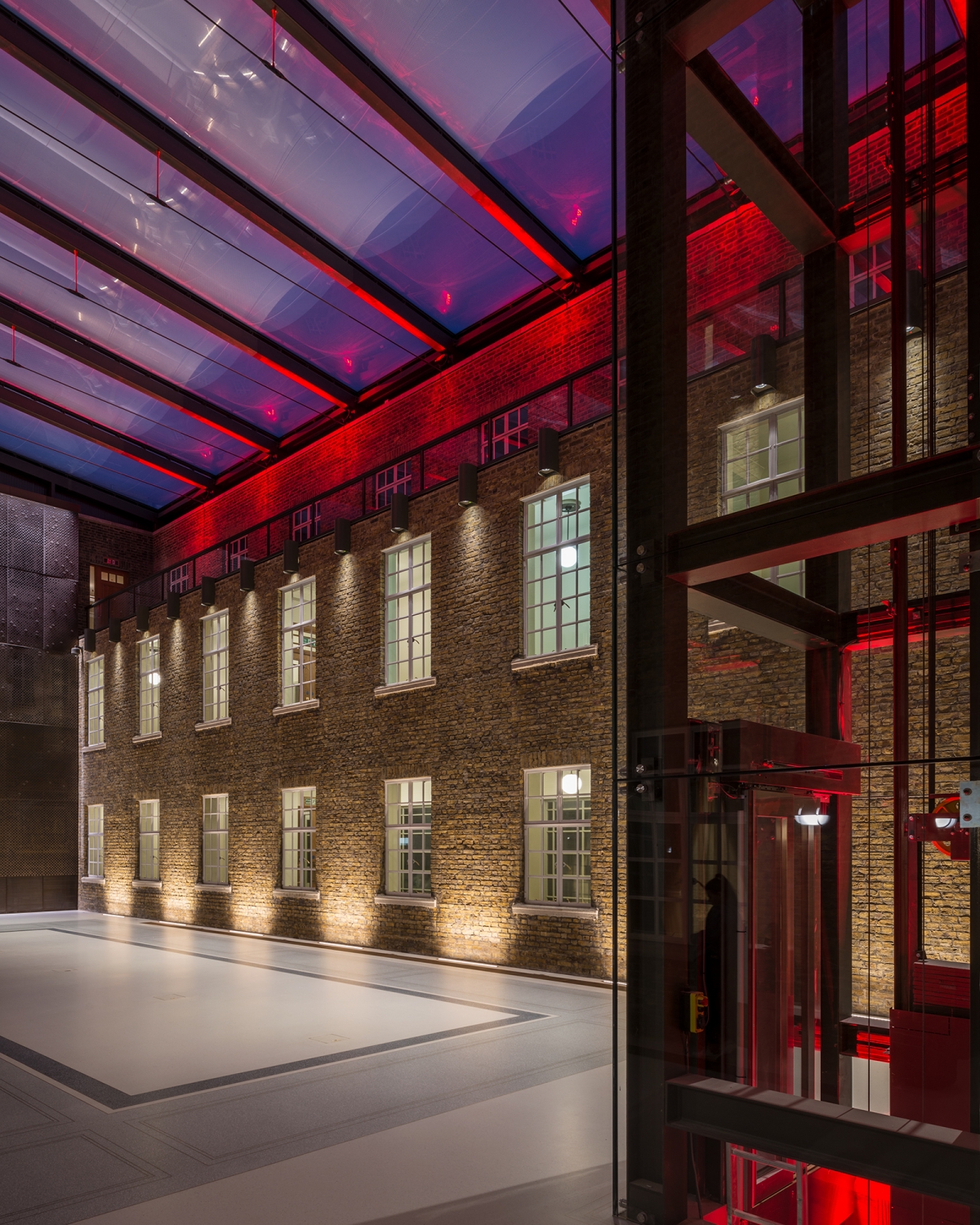 Modern event space at Hackney Town Hall with illuminated brick walls for corporate events.