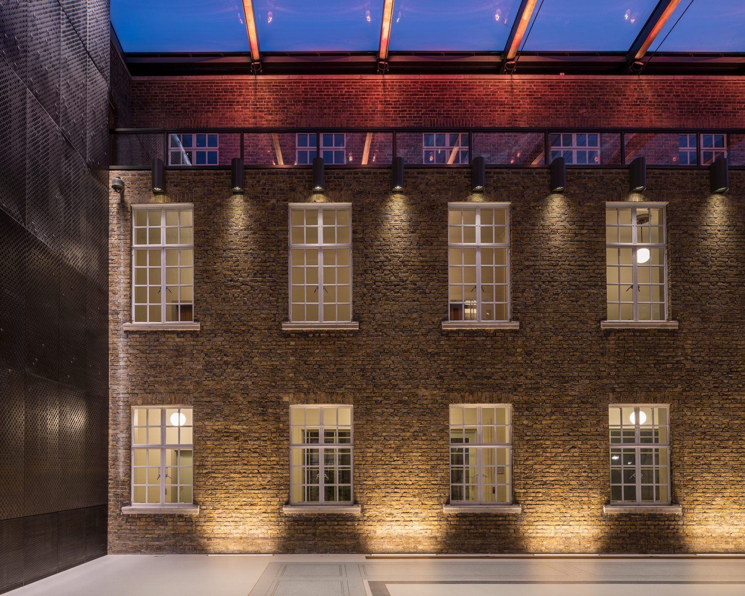 Atria at Hackney Town Hall: elegant brick venue for events with warm lighting.