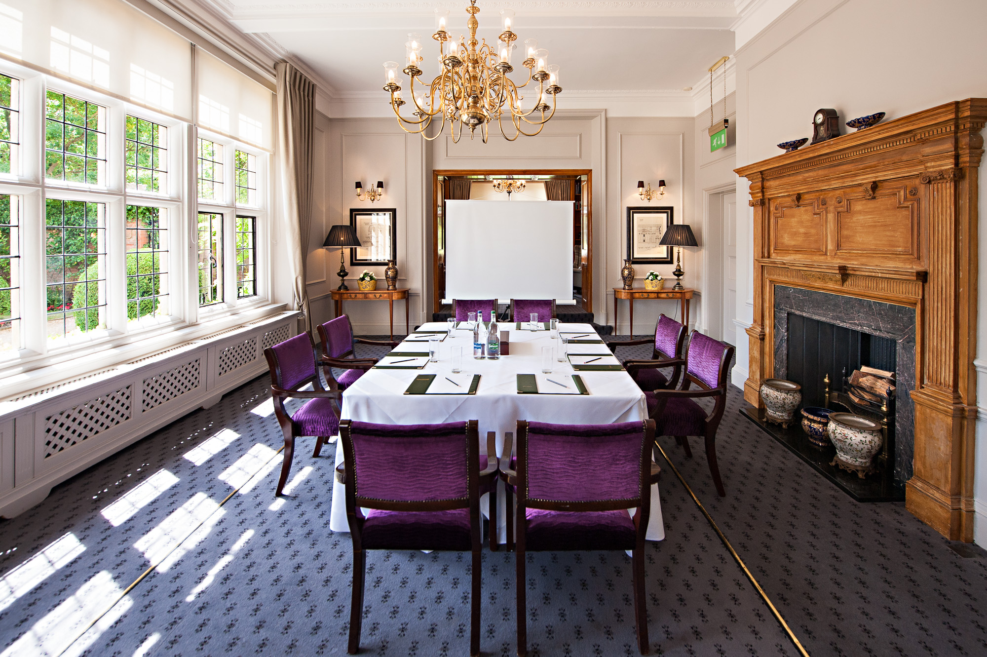 Library Suite at Greenwoods Hotel: elegant meeting room with chandelier for corporate events.