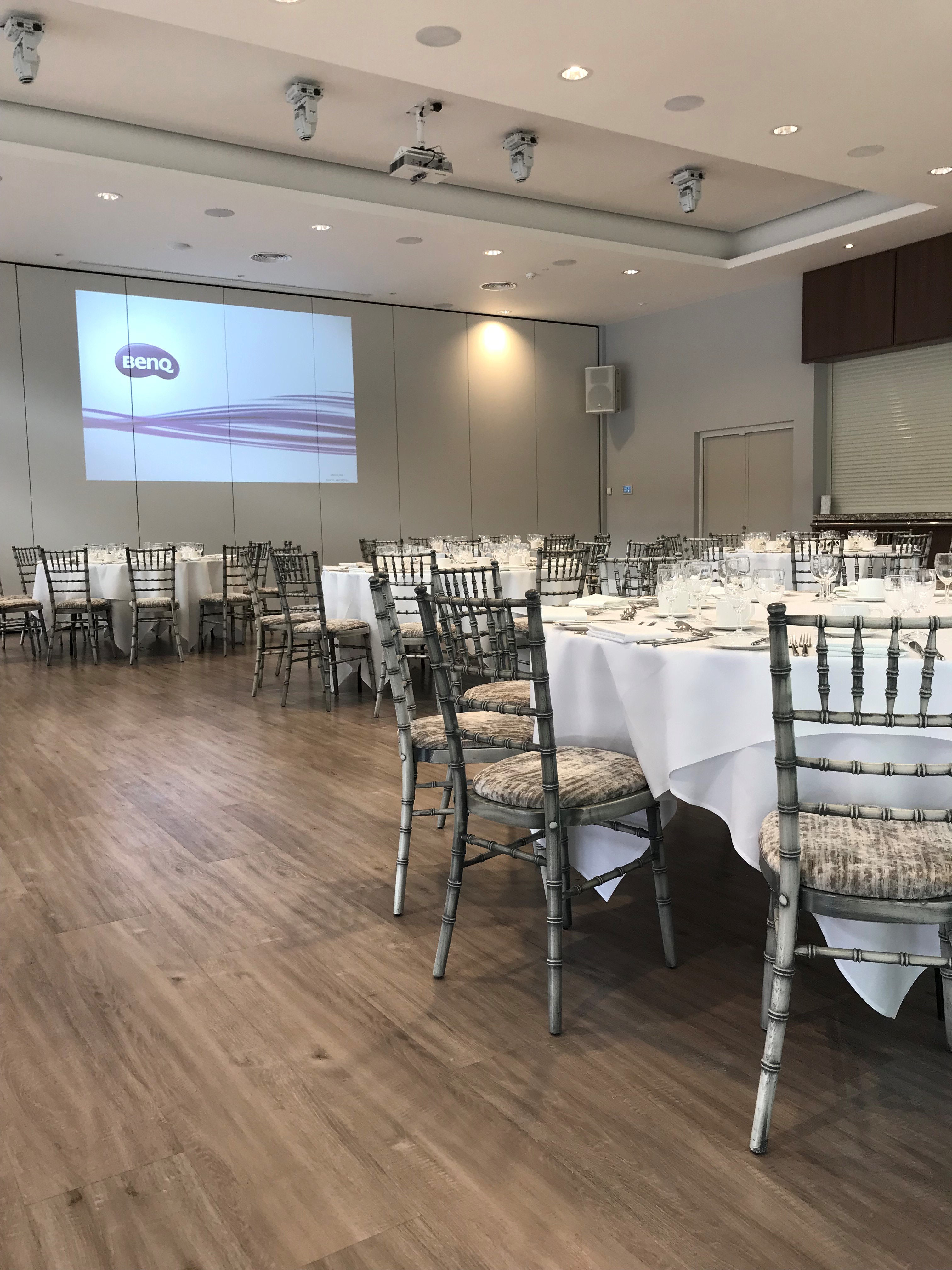 Garden Suite at Greenwoods Hotel, elegant round tables for formal events and presentations.