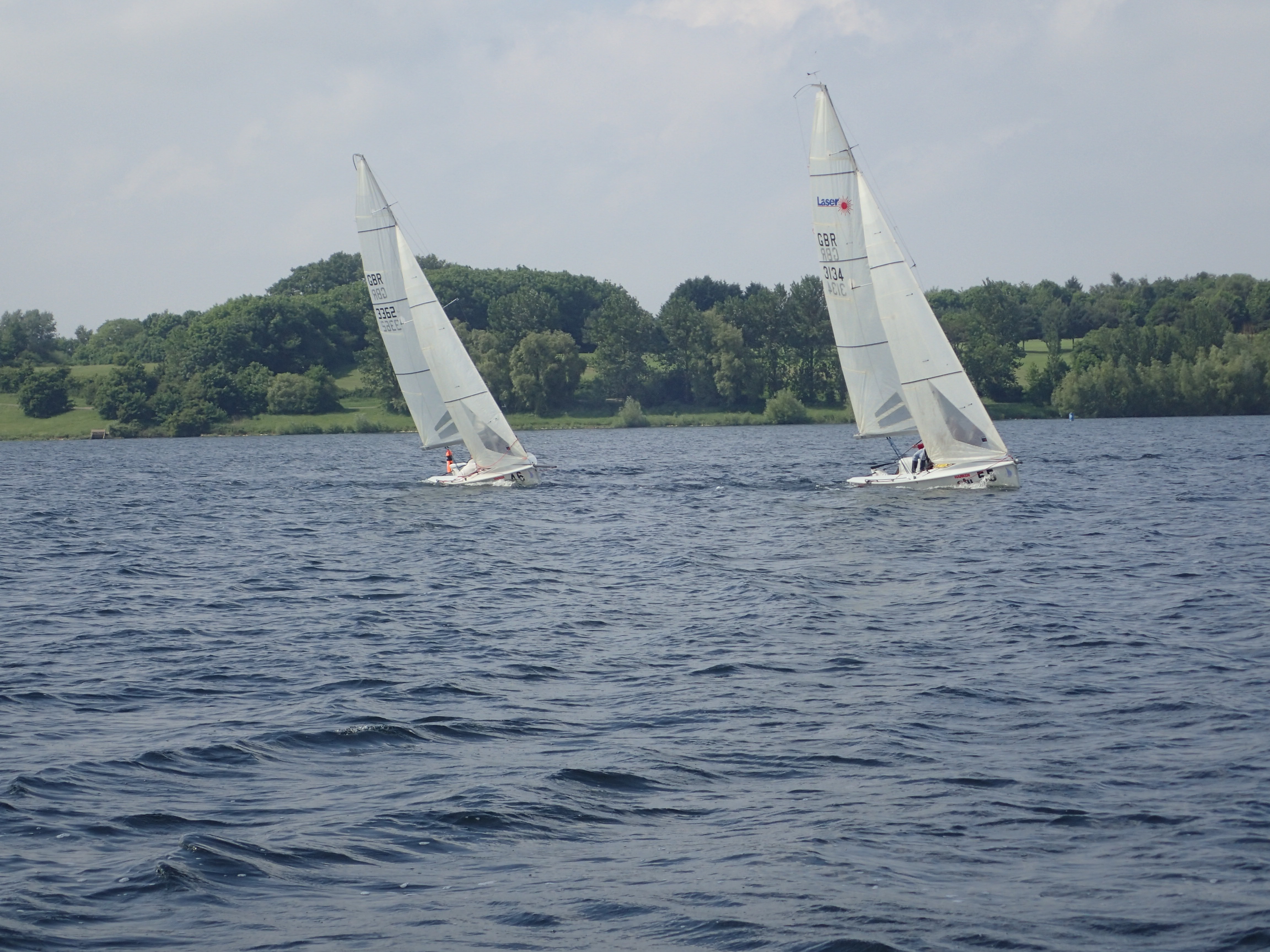Sailboats on serene lake at Farborough Room, ideal for corporate retreats and team-building.