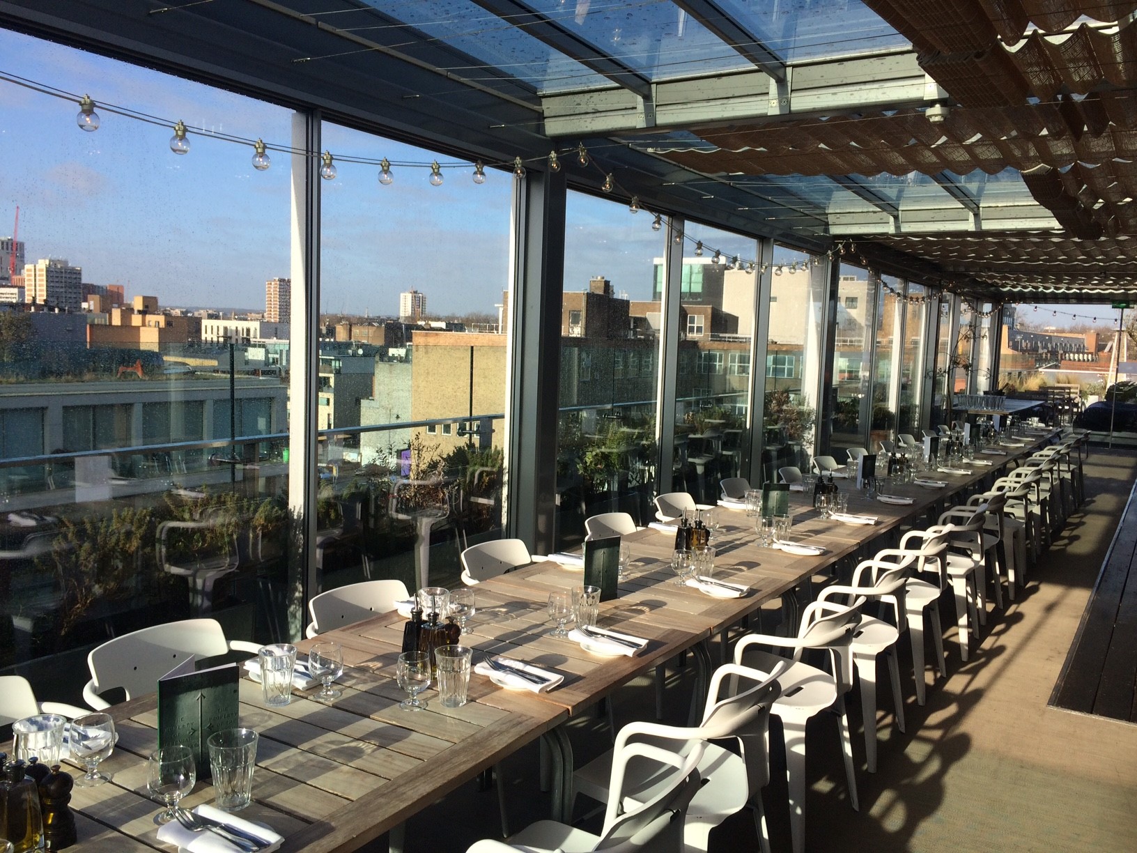Boundary Rooftop dining area with panoramic views, ideal for events and networking.