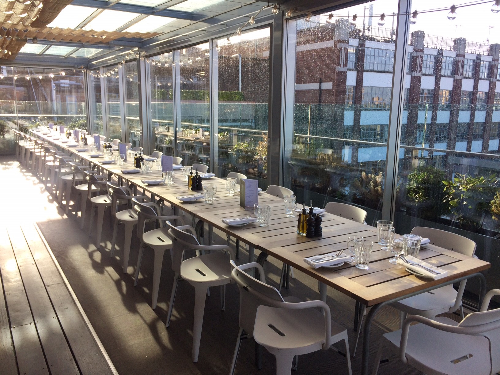 Elegant long table setup at Boundary Rooftop for networking and celebratory events.