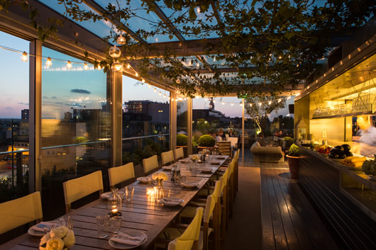 Boundary Rooftop venue in London, featuring warm lighting for upscale events and gatherings.