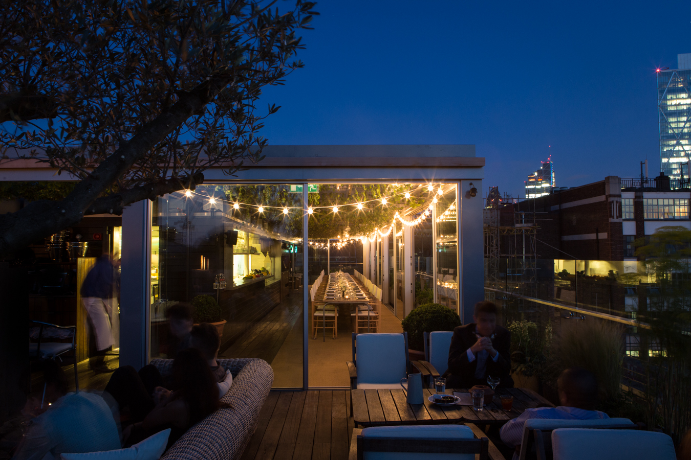 Boundary Rooftop in London with string lights, perfect for evening events and gatherings.