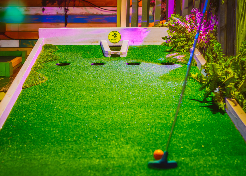 Vibrant mini-golf course at Plonk Crazy Golf, perfect for team-building events.