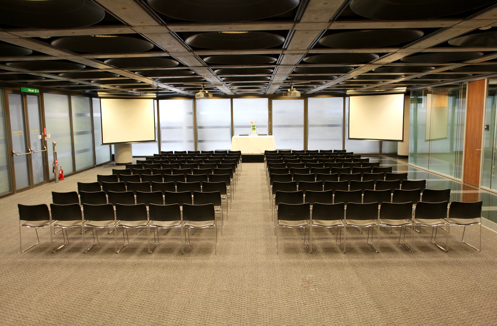 Banqueting Suite at Lloyd's with black chairs, perfect for presentations and workshops.