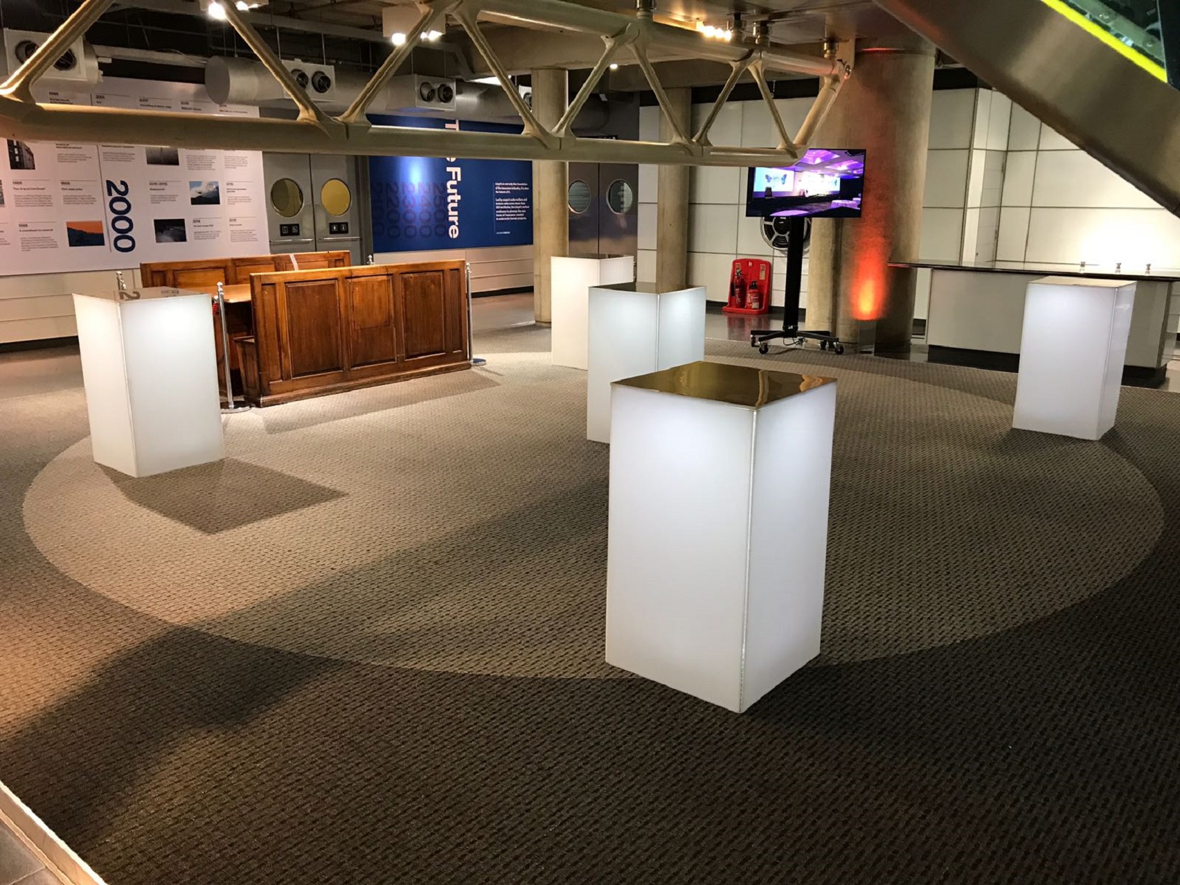 Old Library at Lloyd's event space with illuminated displays for networking and exhibitions.