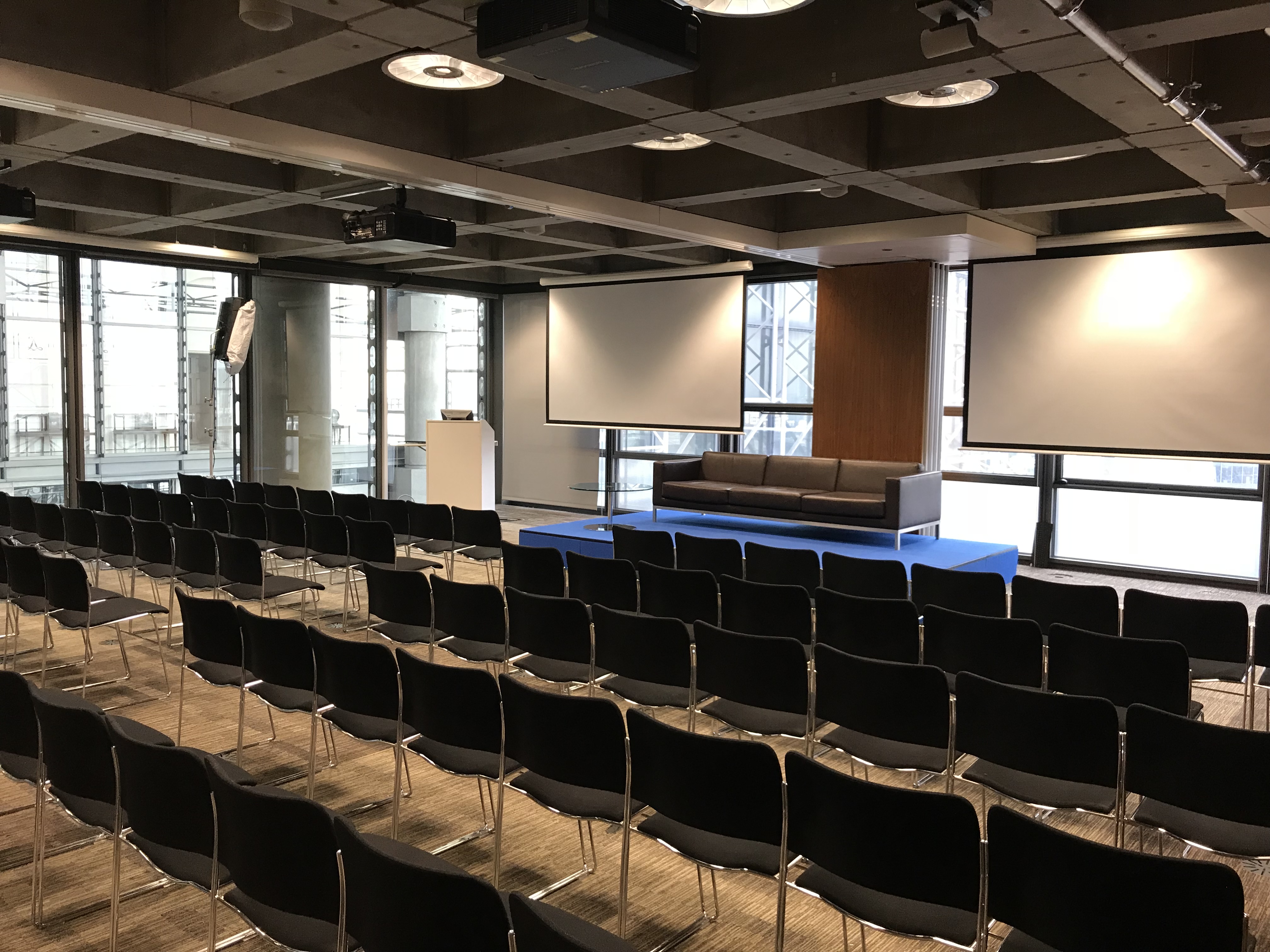 Modern event space at The London Rooms with risers for presentations.