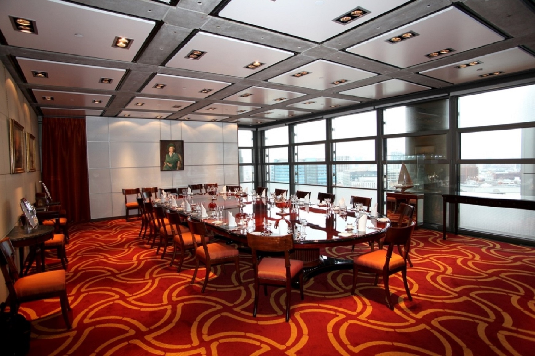 Elegant boardroom in The Boston Room, ideal for meetings and private dining events.