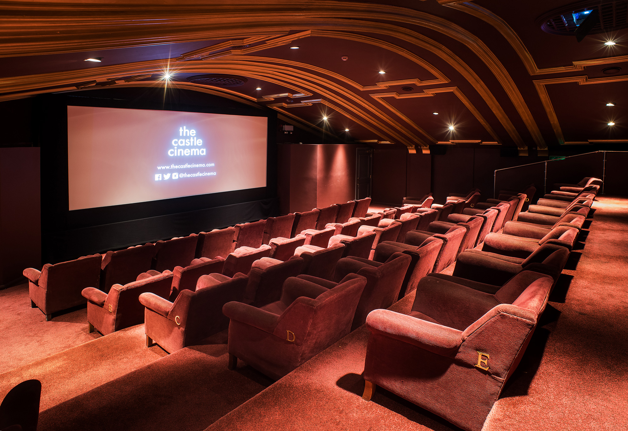 Cozy cinema seating in The Castle Cinema for private events and film screenings.