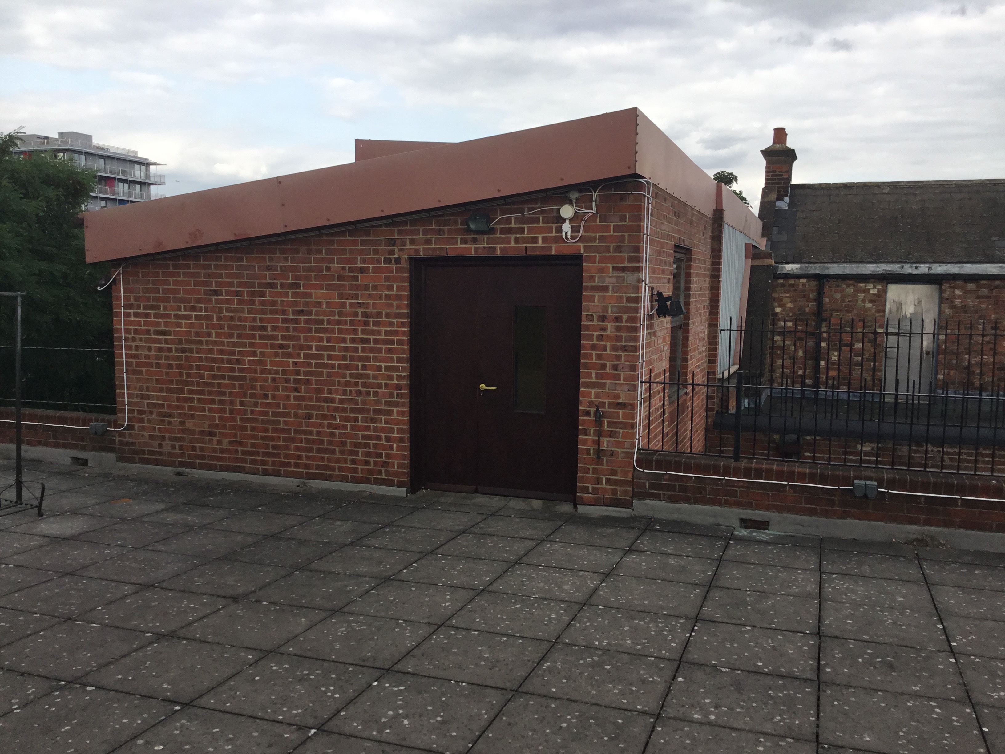 Rooftop venue at The Midi Music Company with brick structure for unique outdoor events.