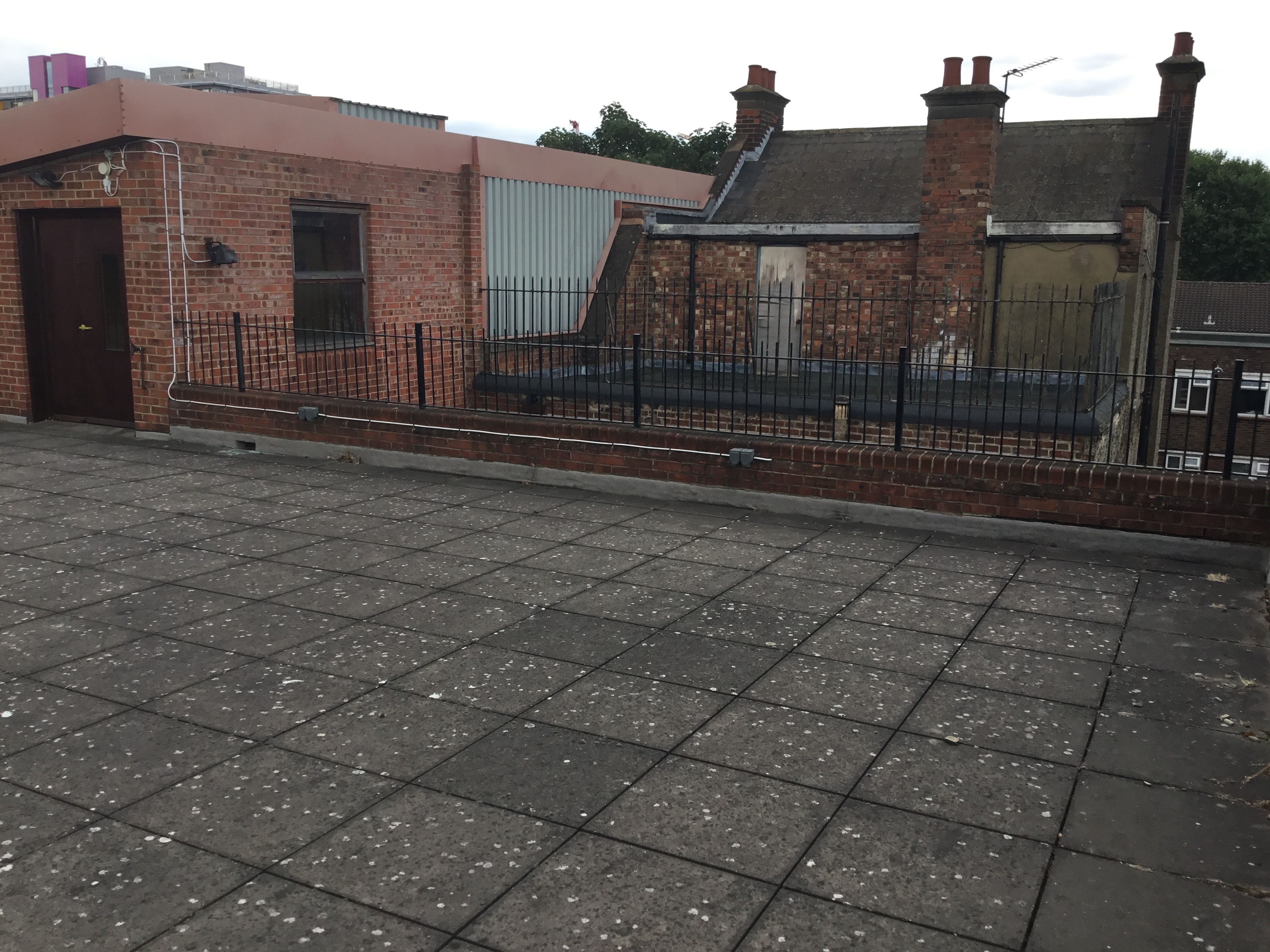 Rooftop event space at The Midi Music Company with open area for gatherings.