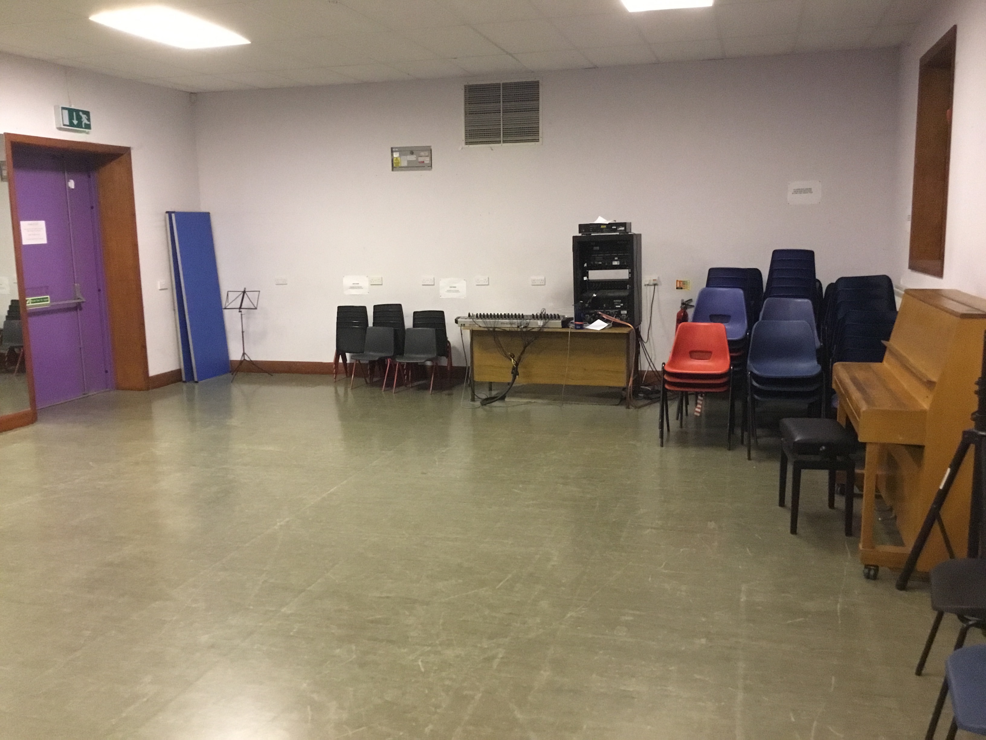 Versatile meeting space with piano for events at The Midi Music Company.