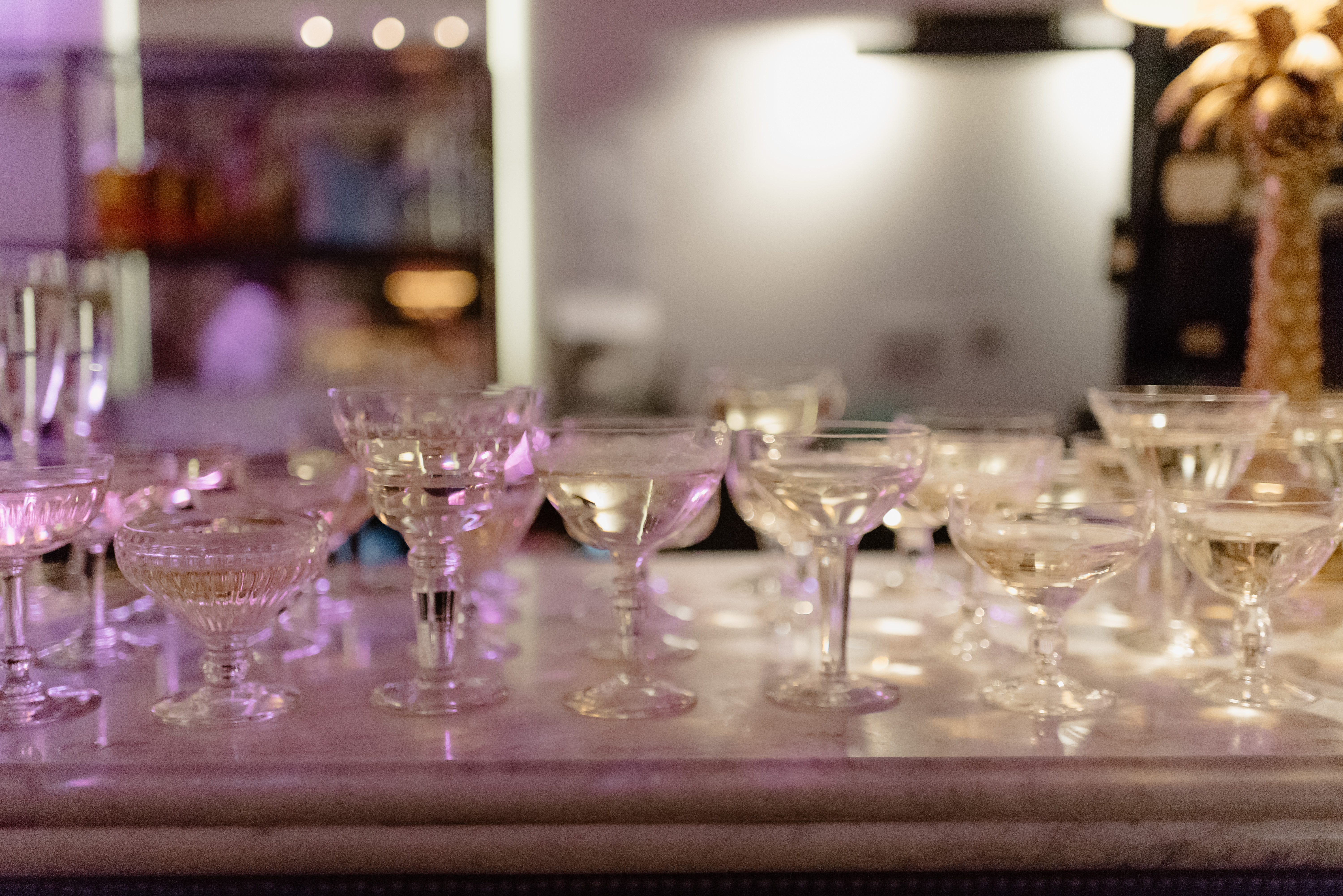 Elegant glassware display at The Castle Cinema bar for upscale events and receptions.