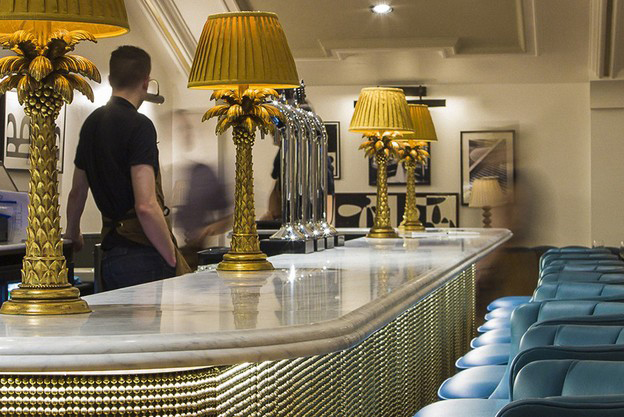Stylish bar with pineapple lamps in The Castle Cinema, perfect for networking events.