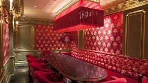 Luxurious red meeting space at Salon Rouge, perfect for exclusive events and discussions.