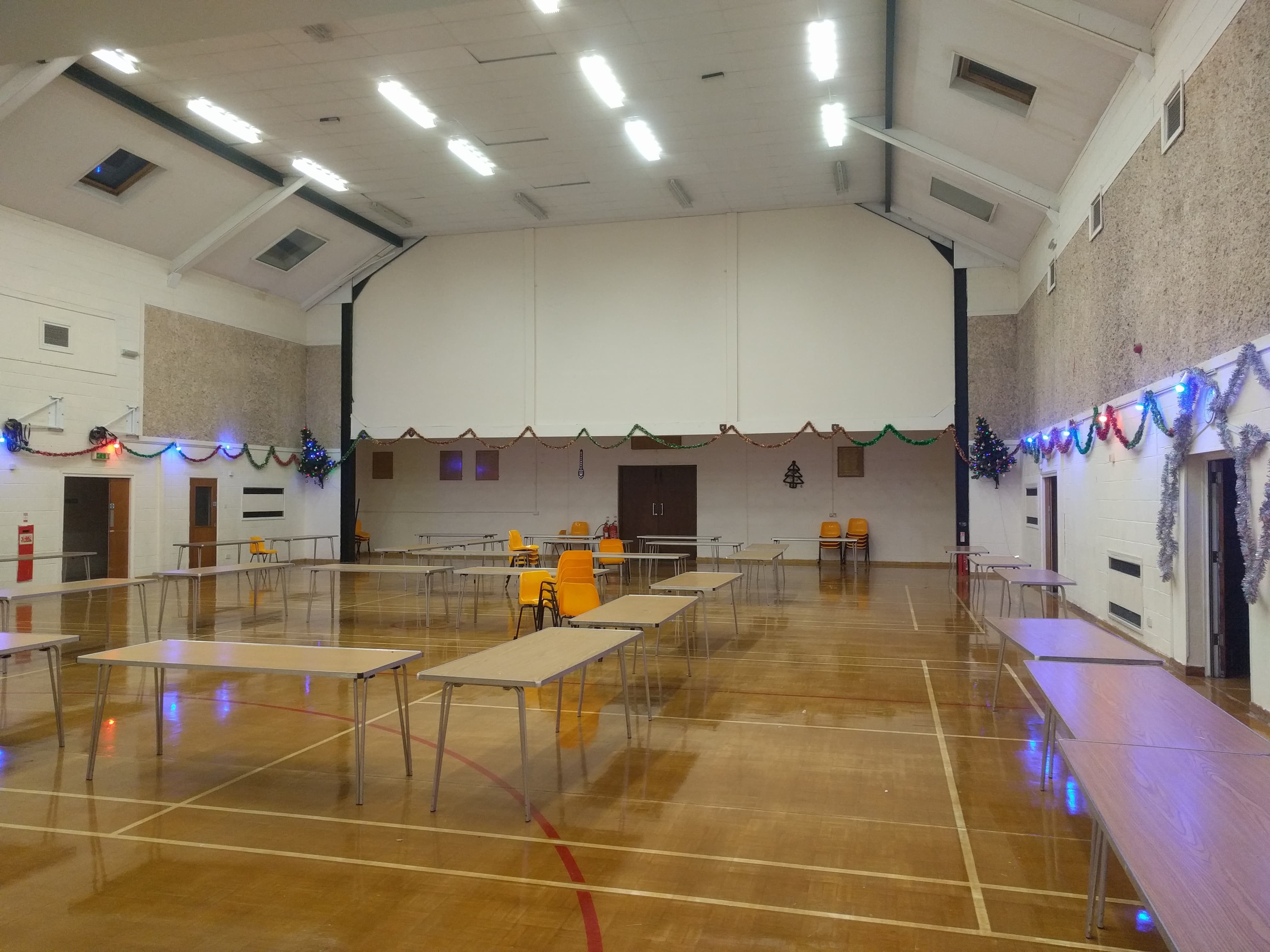 Spacious Wickham Community Centre Main Hall for meetings and events with festive decor.