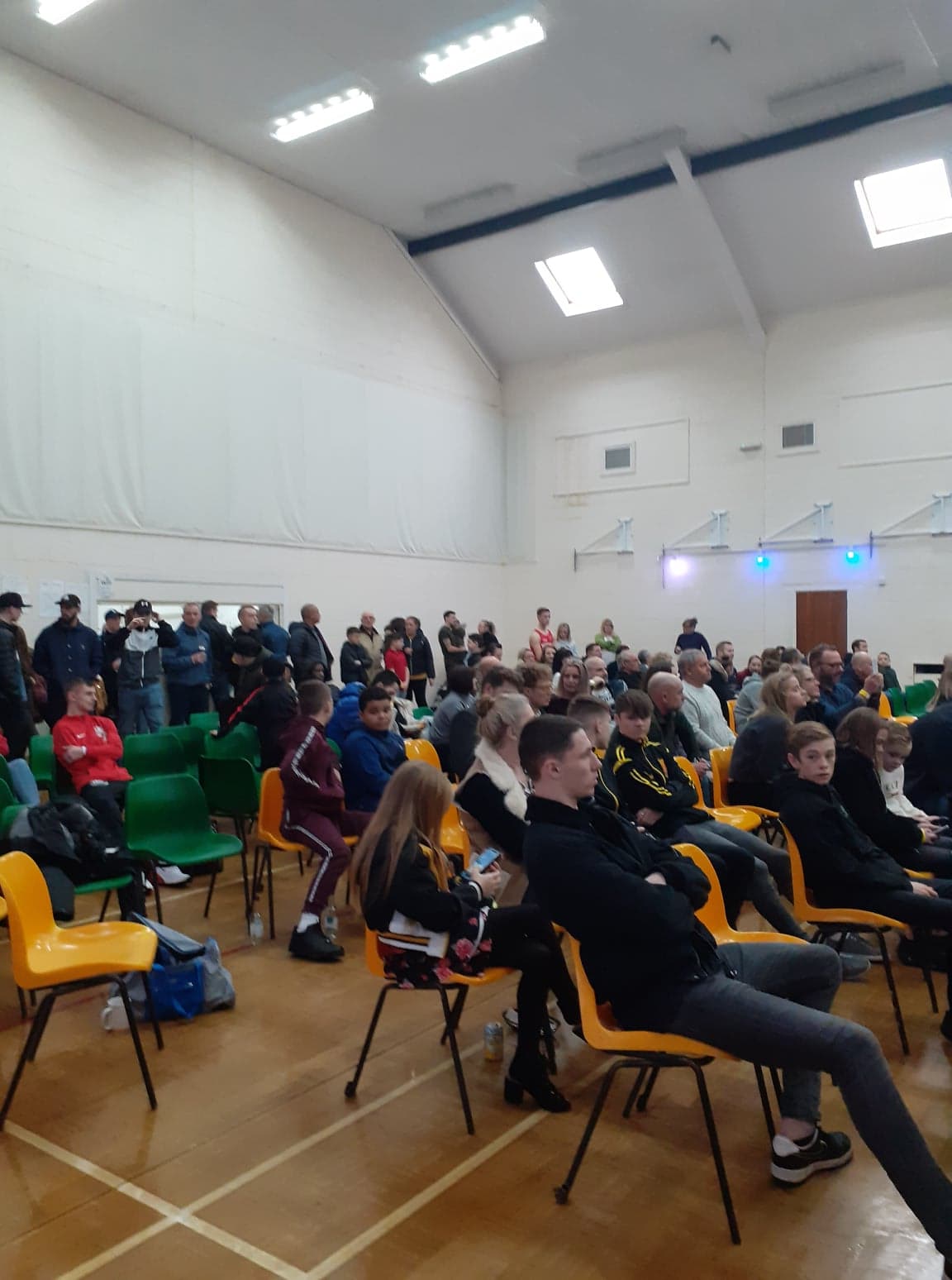 Diverse audience in Main Hall at Wickham Community Centre for a community event.