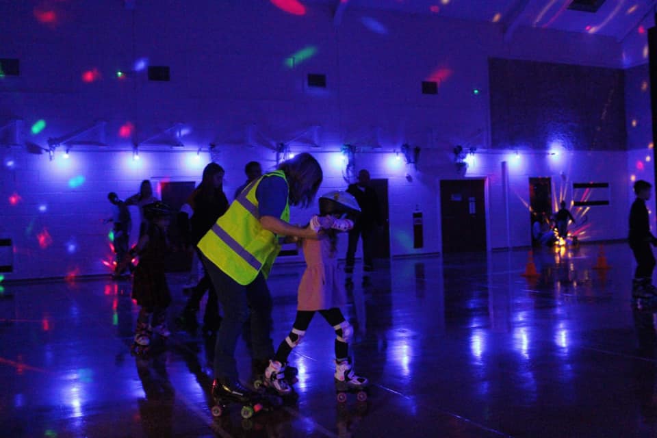 Vibrant roller skating event in Wickham Community Centre's Main Hall, perfect for family fun.