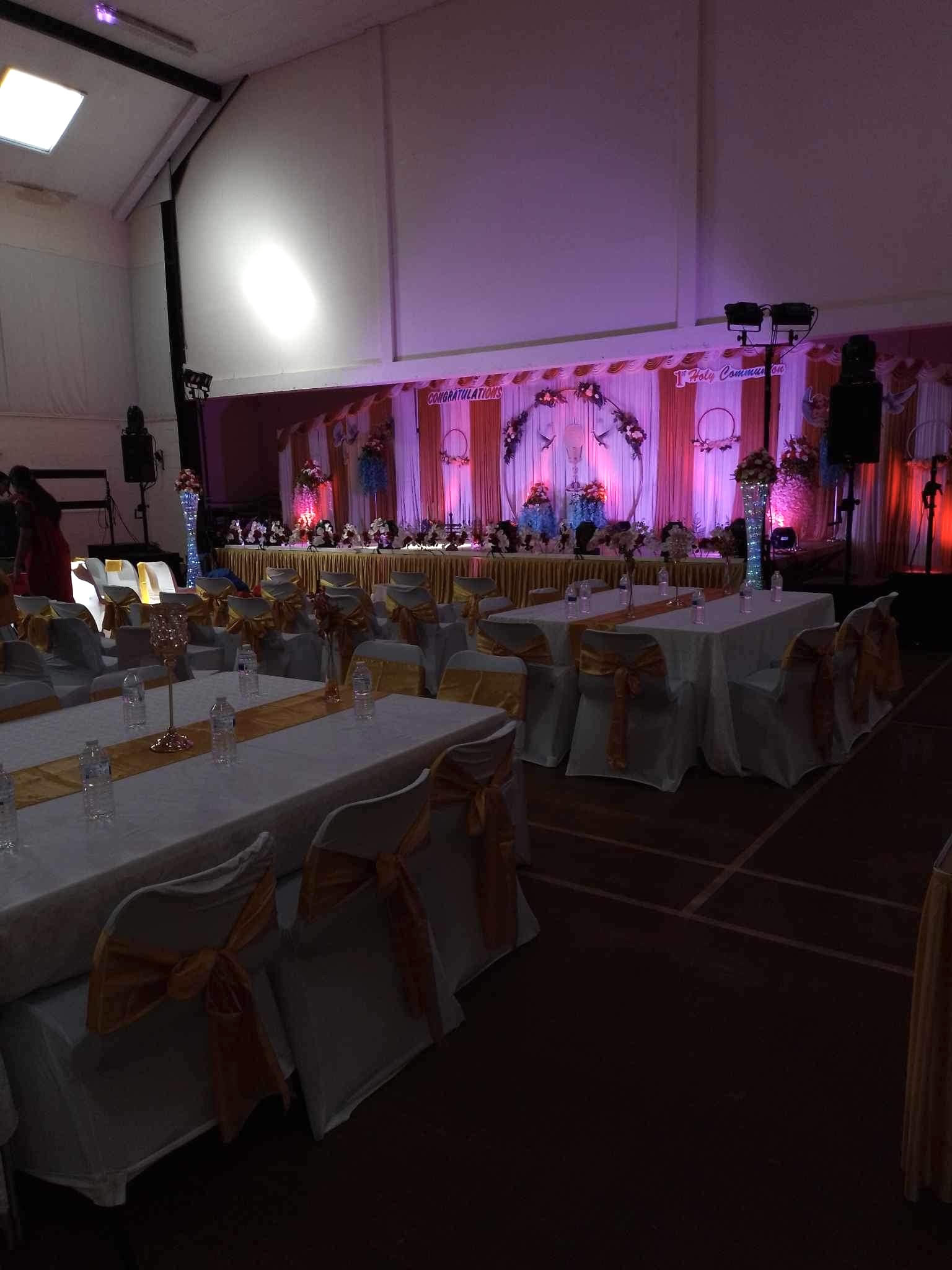 Elegant event space in Wickham Community Centre with draped tables for celebrations.