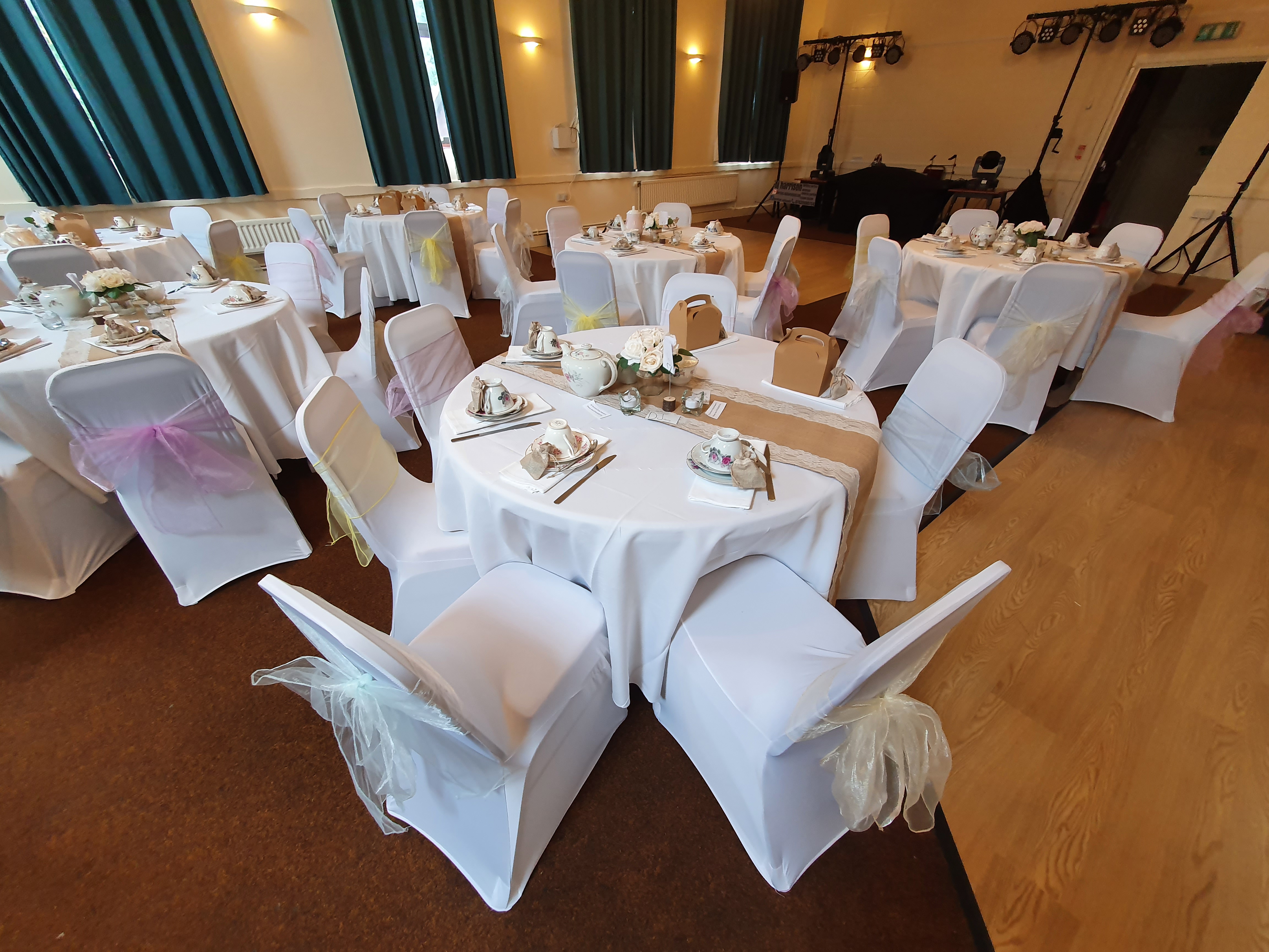 Elegant Woodford Suite event space with white linens, perfect for weddings and gatherings.